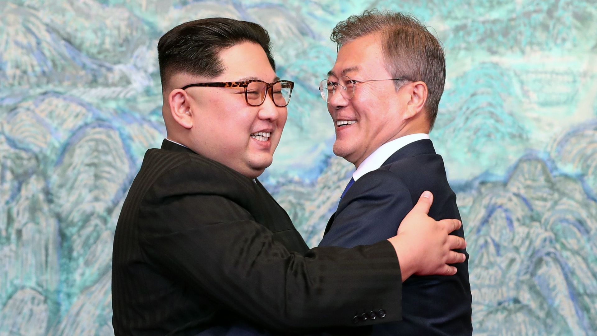 Kim Jong-un and Moon Jae-in embrace