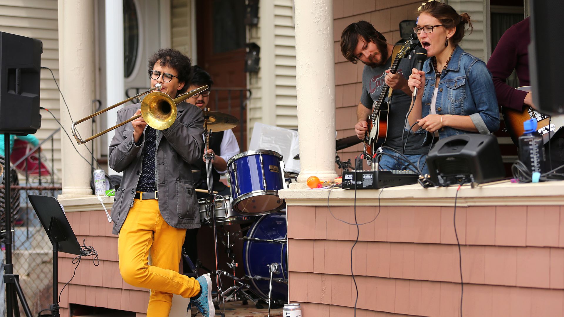 a band performs on a house porch