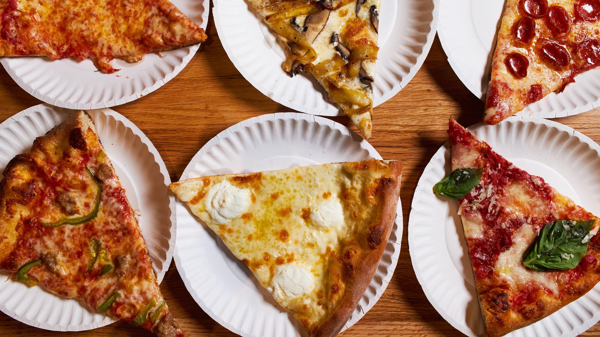 Individual slices from Andy's Pizza (top left to right clockwise) Cheese, Mushroom and Onion, Pepperoni, Margherita, White and Sausage & Pepper from Andy's Pizza.