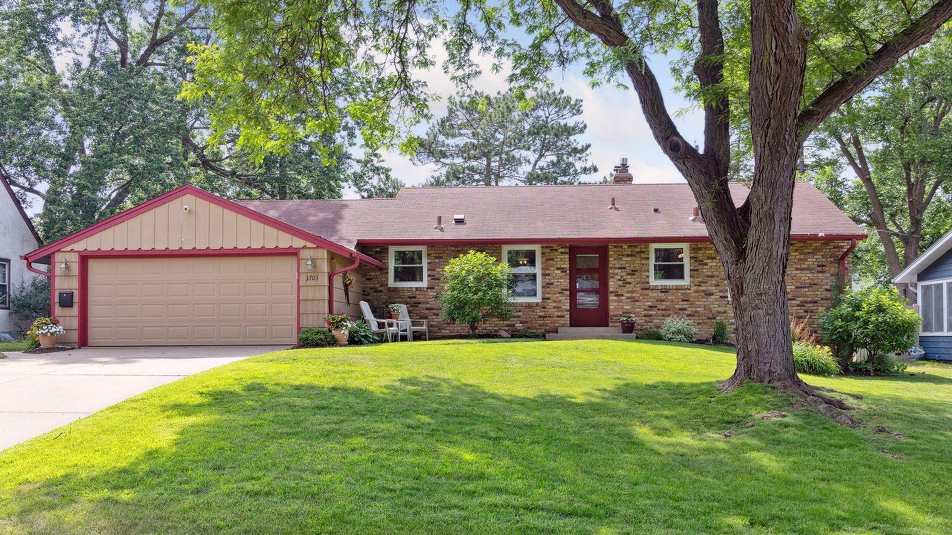 outside front view of brick and cedar home