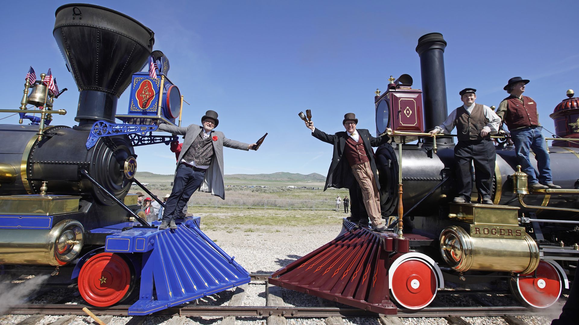 Workers celebrate the 150th anniversary of the Transcontinental Railroad