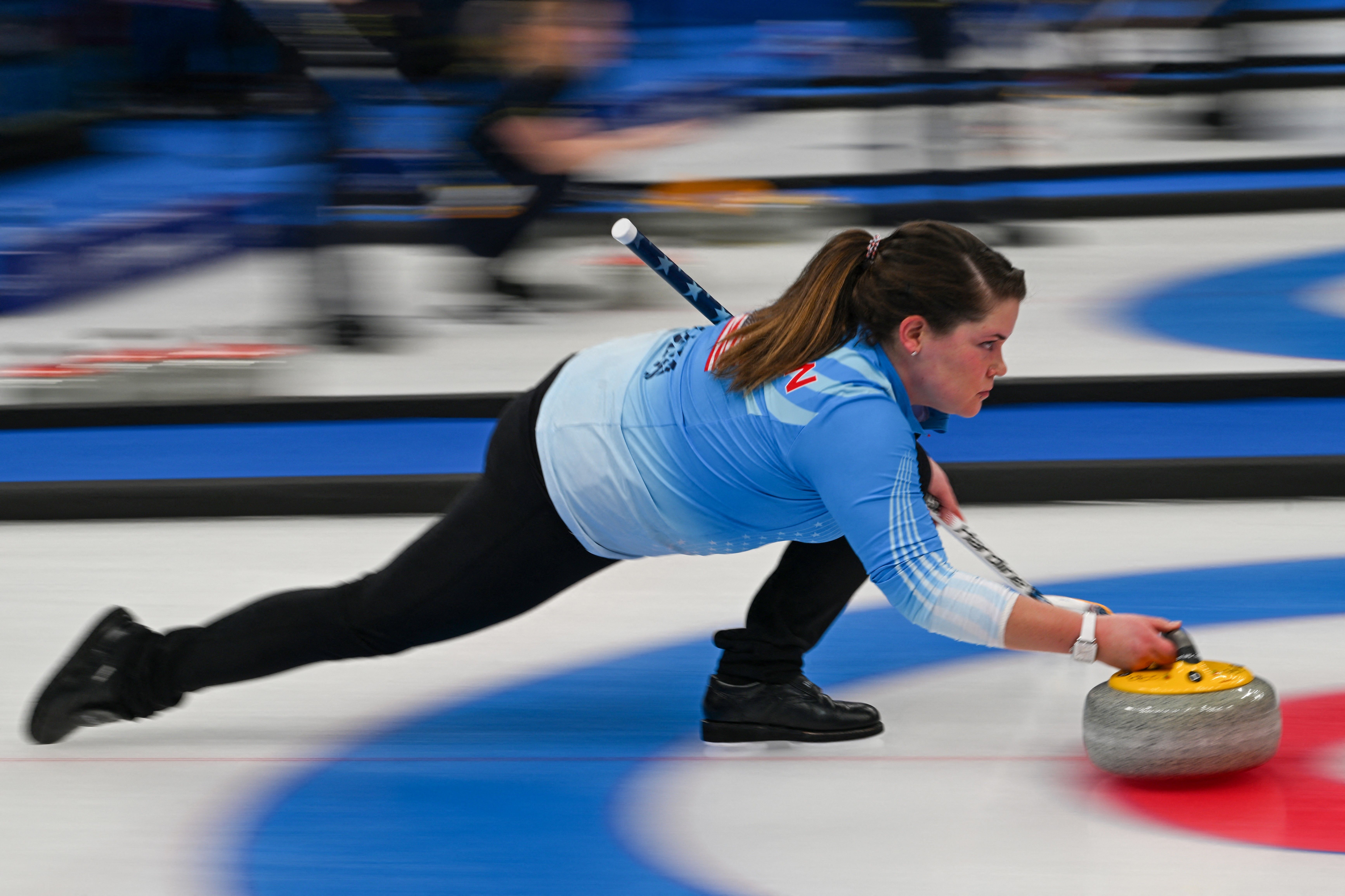  Rebecca Hamilton of the US curls the stone during the women's round robin session 1 game of the Beijing 2022 Winter Olympic Games curling competition