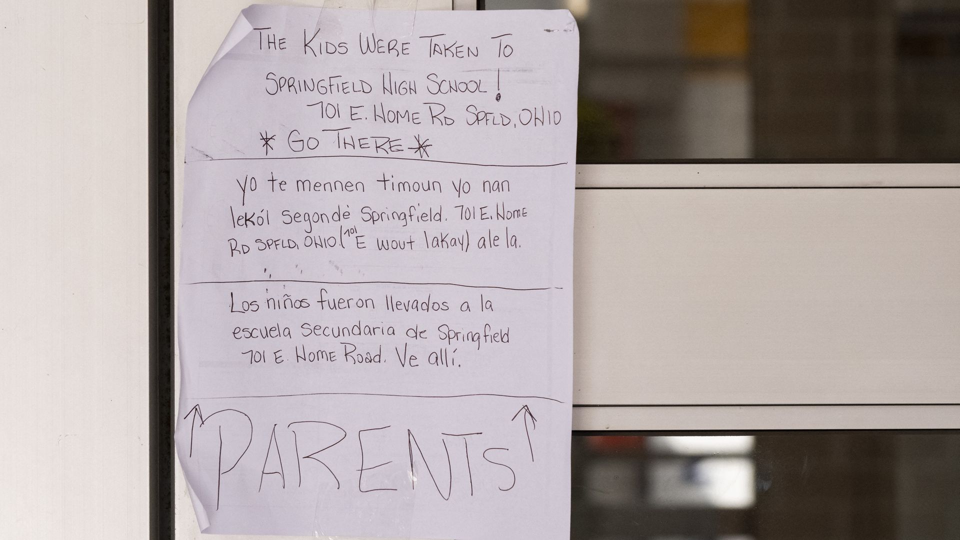 A sign posted on the door of a school informing parents of their students' whereabouts 