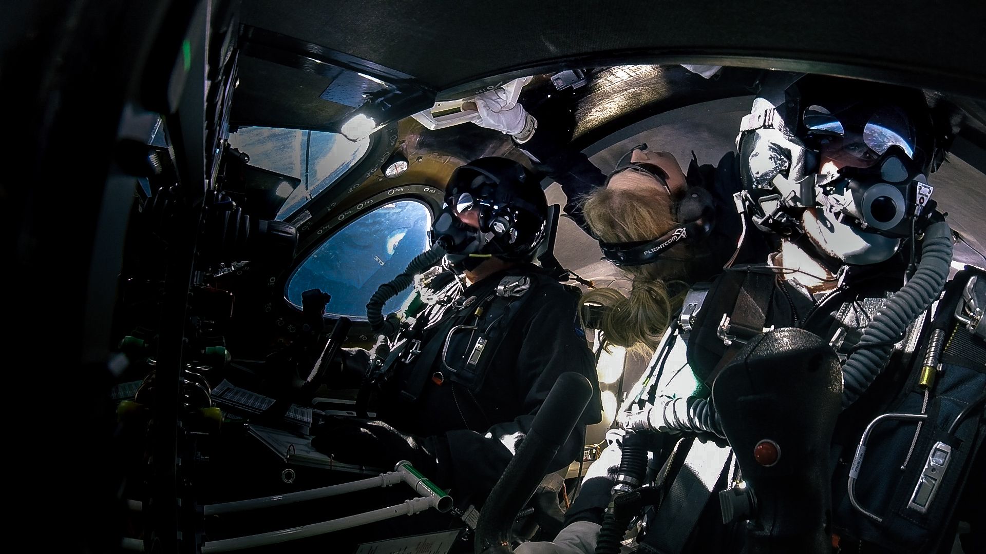 Crew members on board the VSS Unity as the space craft reaches the edge of space.