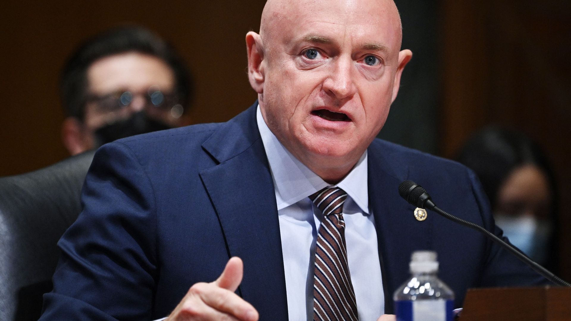 Sen. Mark Kelly is seen speaking on Capitol Hill.