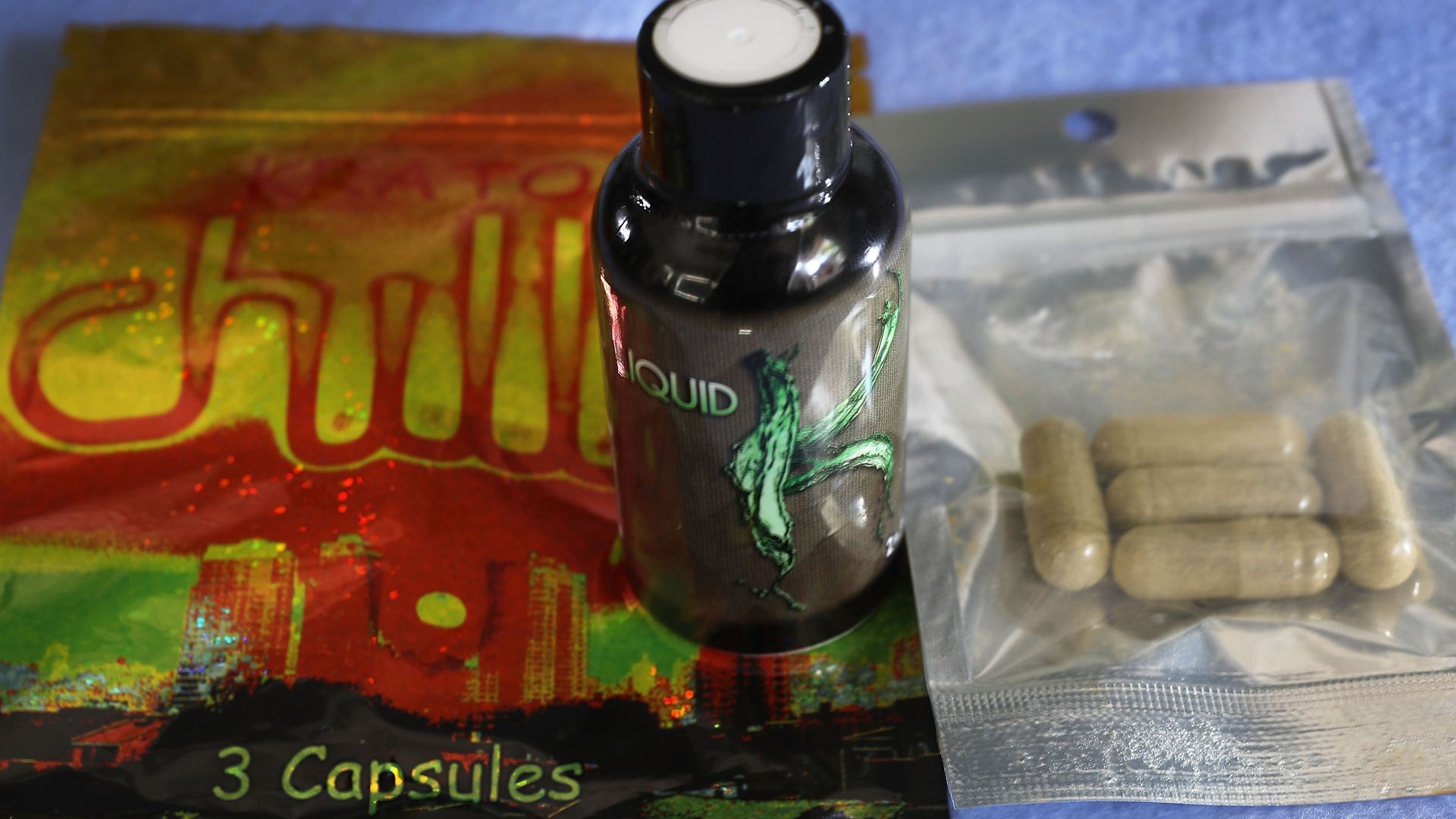 In this photo illustration, a bottle with Kratom liquid and bags of capsules with the herbal supplement Kratom inside are seen. The herbal supplement is a psychoactive drug derived from the leaves of the kratom plant and it's been reported that people are using the supplement to get high and some st