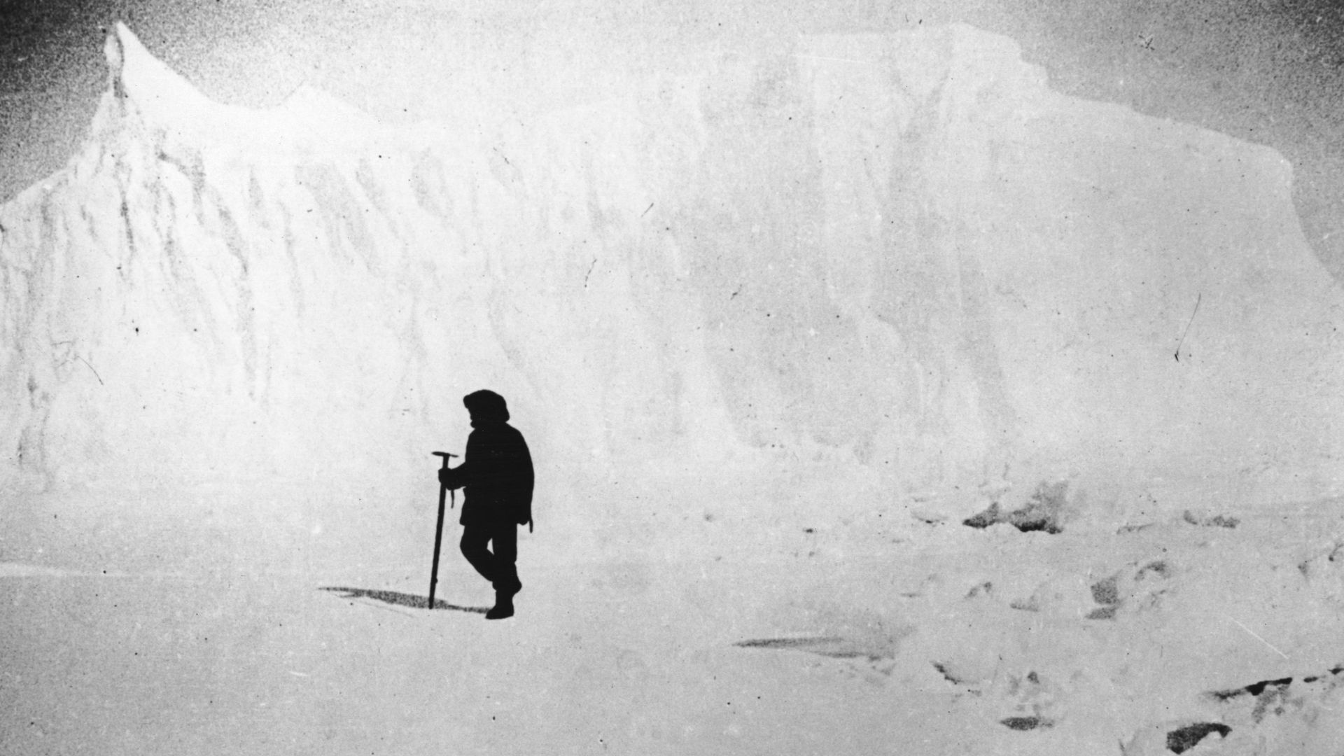 1911: Norwegian explorer Captain Roald Amundsen, the first man to reach the South Pole, inspecting ice fields near a glacier in the Atlantic Ocean.