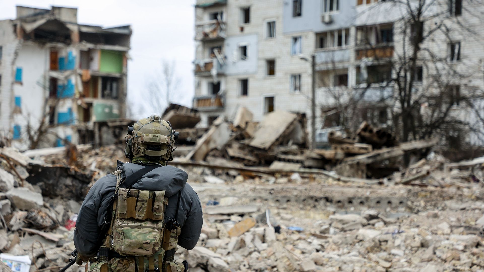 A military man looks at the ruins of buildings destroyed by Russian shelling, amid Russia's Invasion of Ukraine, in Borodyanka, Kyiv region, Ukraine, April 13.