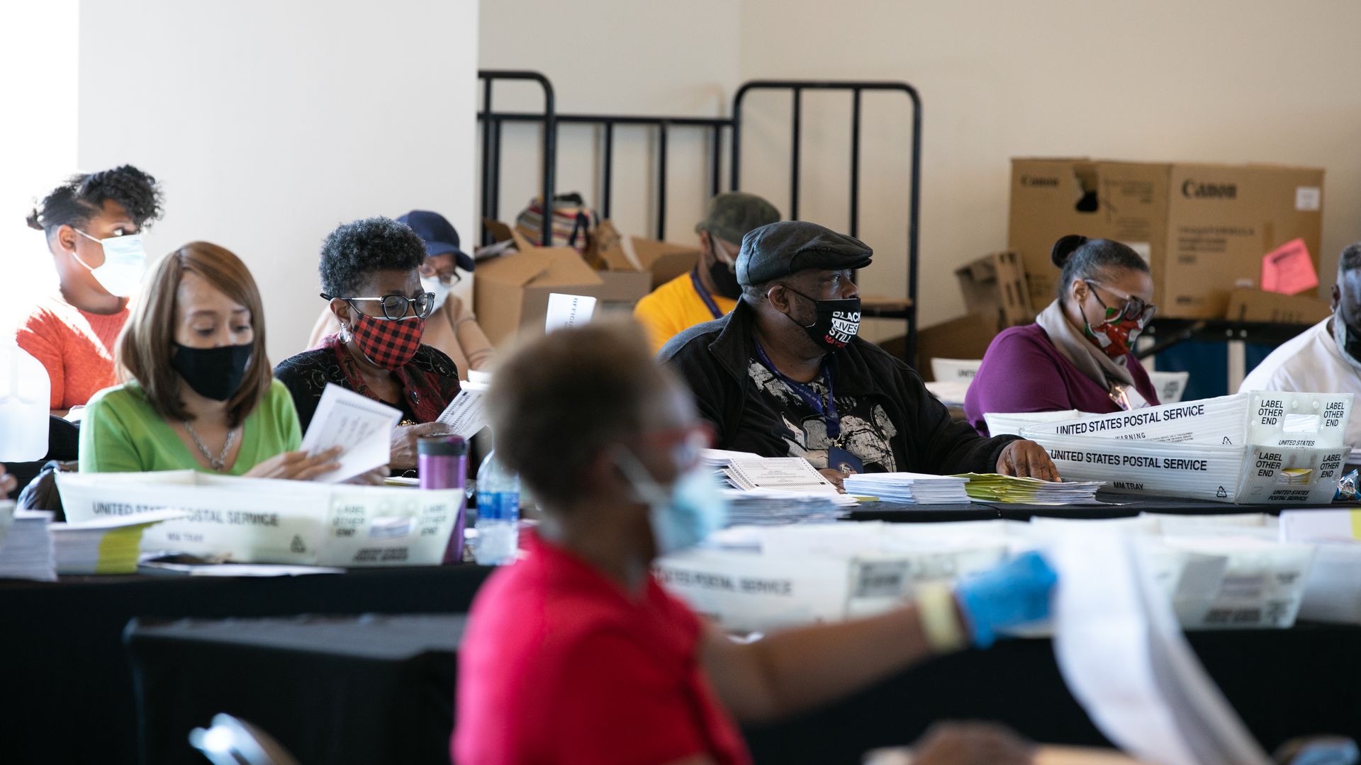 Election workers count Fulton County ballots at State Farm Arena on November 4, 2020 in Atlanta, Georgia.