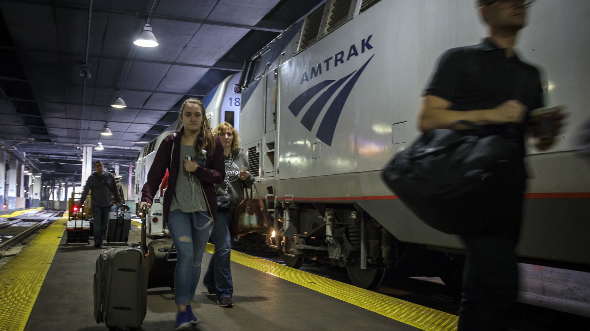 Passengers board an Amtrak Empire Builder train Tuesday, March 28, 2017, at Union Station in Chicago.