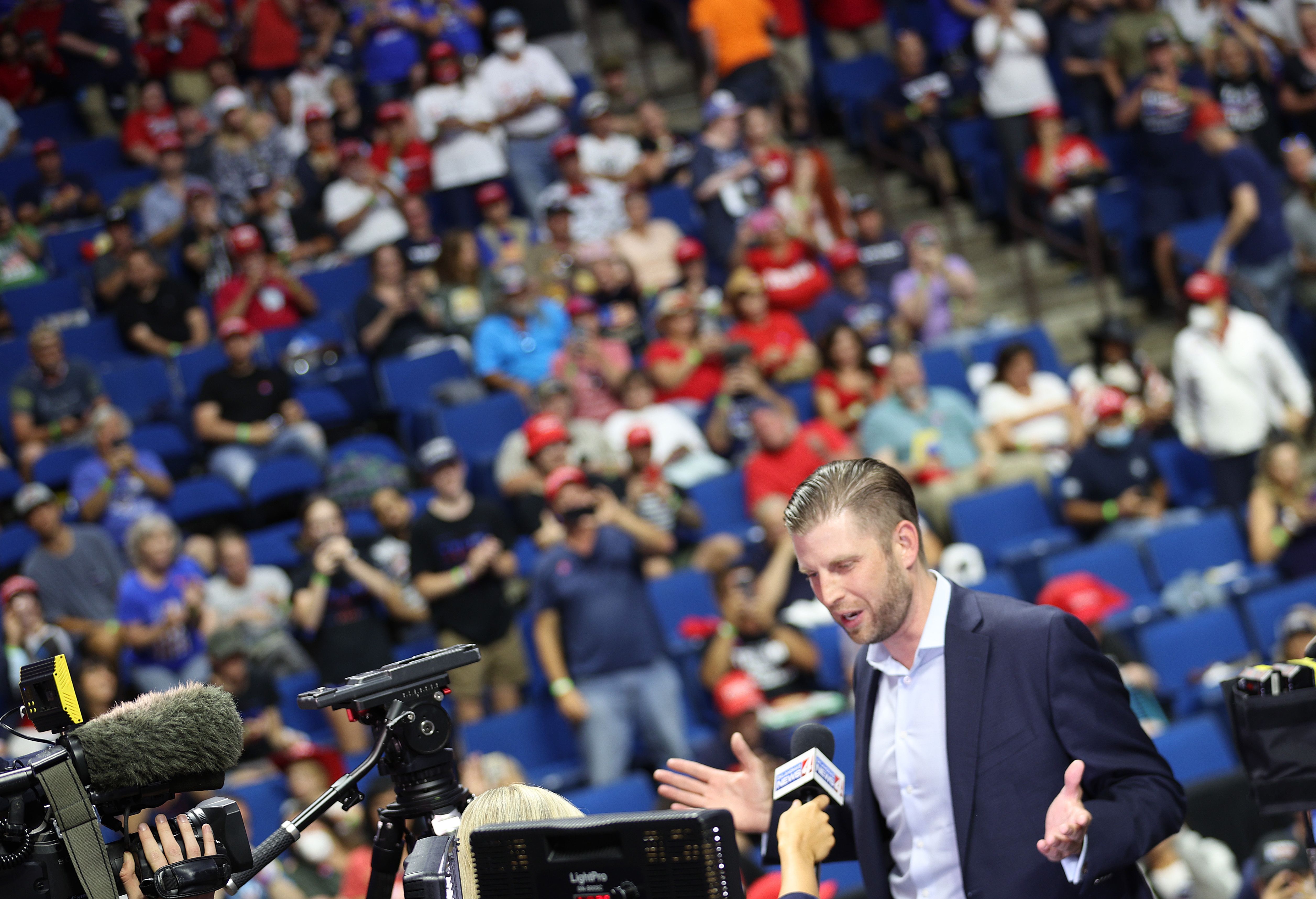 Eric Trump stands in front of a large crowd