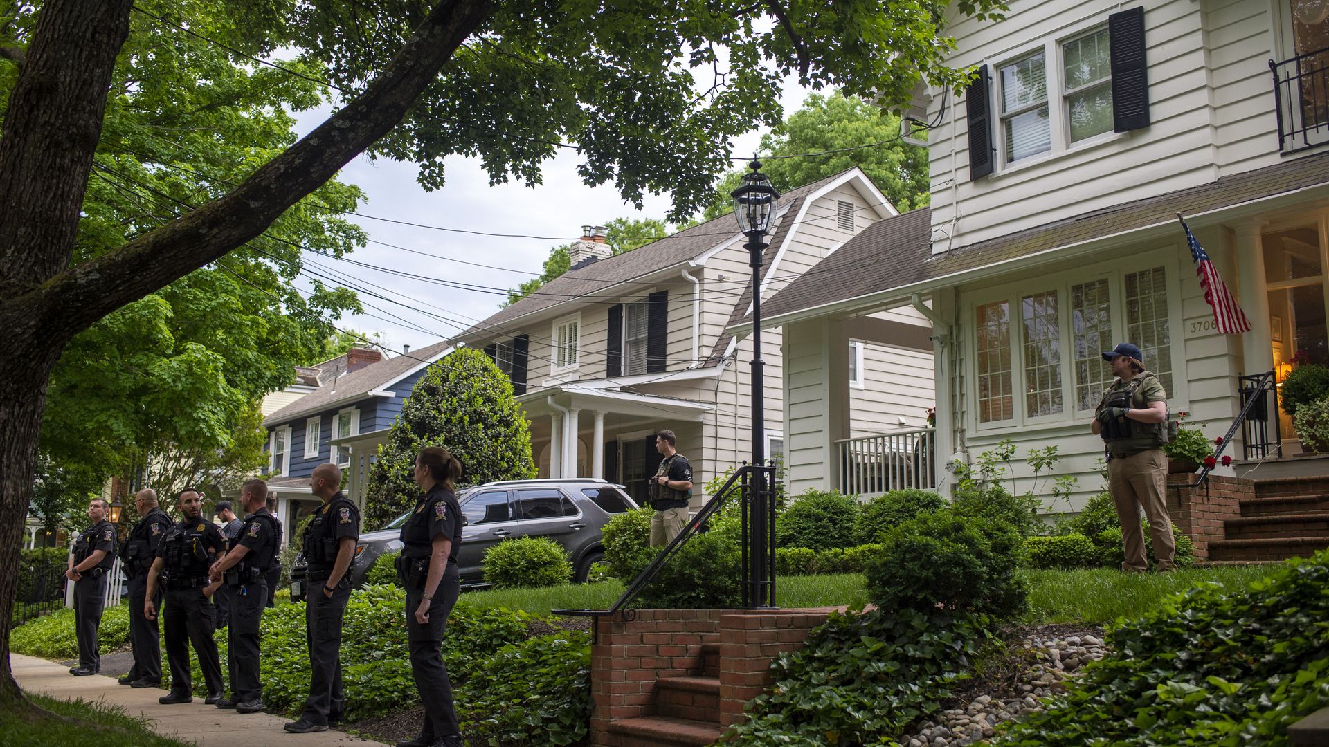 Police officers outside Supreme Court Justice Brett Kavanaugh's home in Chevy Chase, Maryland, on June 8.
