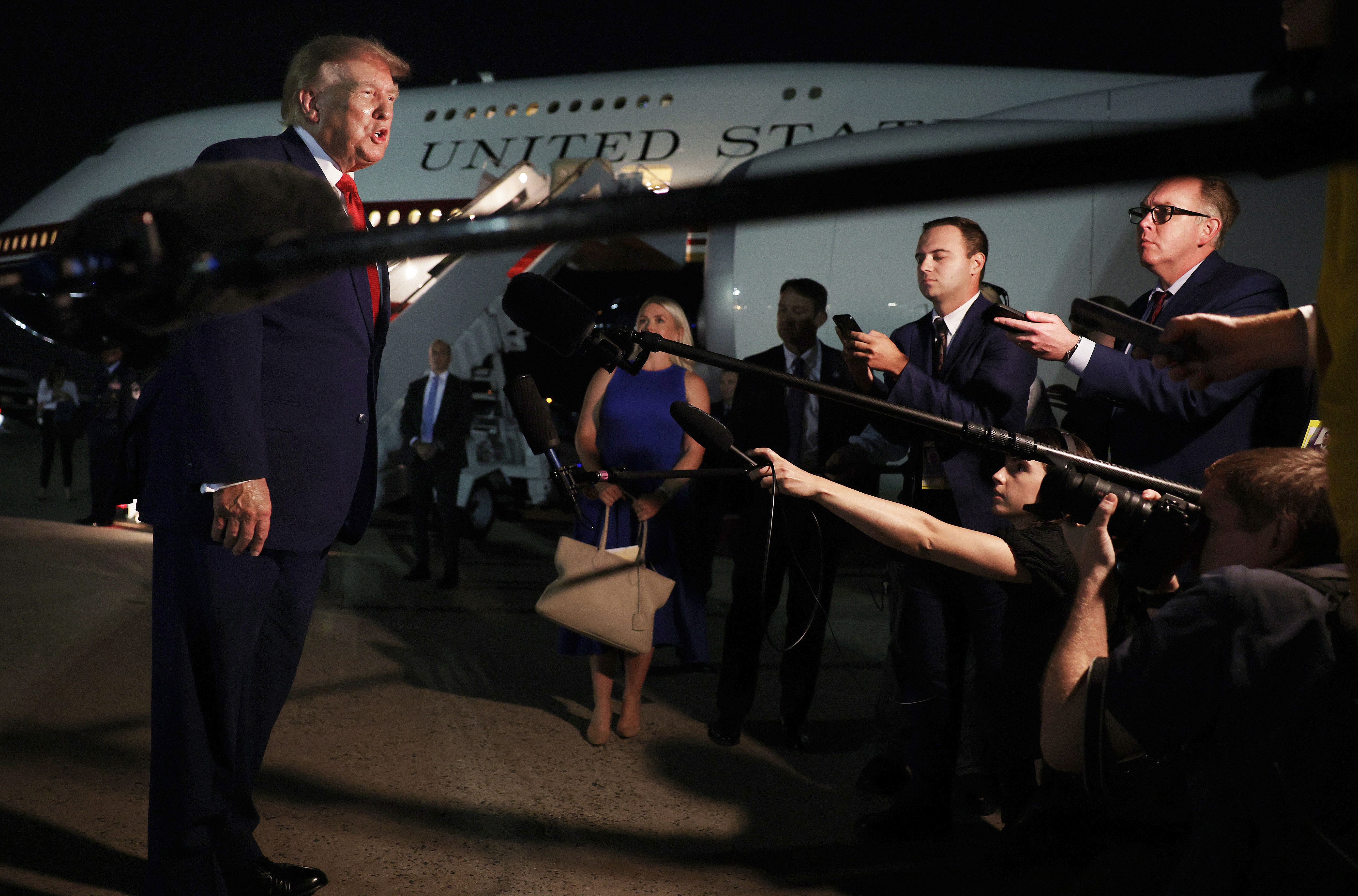JOINT BASE ANDREWS, MARYLAND - AUGUST 11: U.S. President Donald Trump speaks to reporters after stepping off Air Force One on August 11, 2026 in Joint Base Andrews, Maryland. Trump was asked about the secret decoy flight he took out of Turkey in a military aircraft. The president was returning to Wa