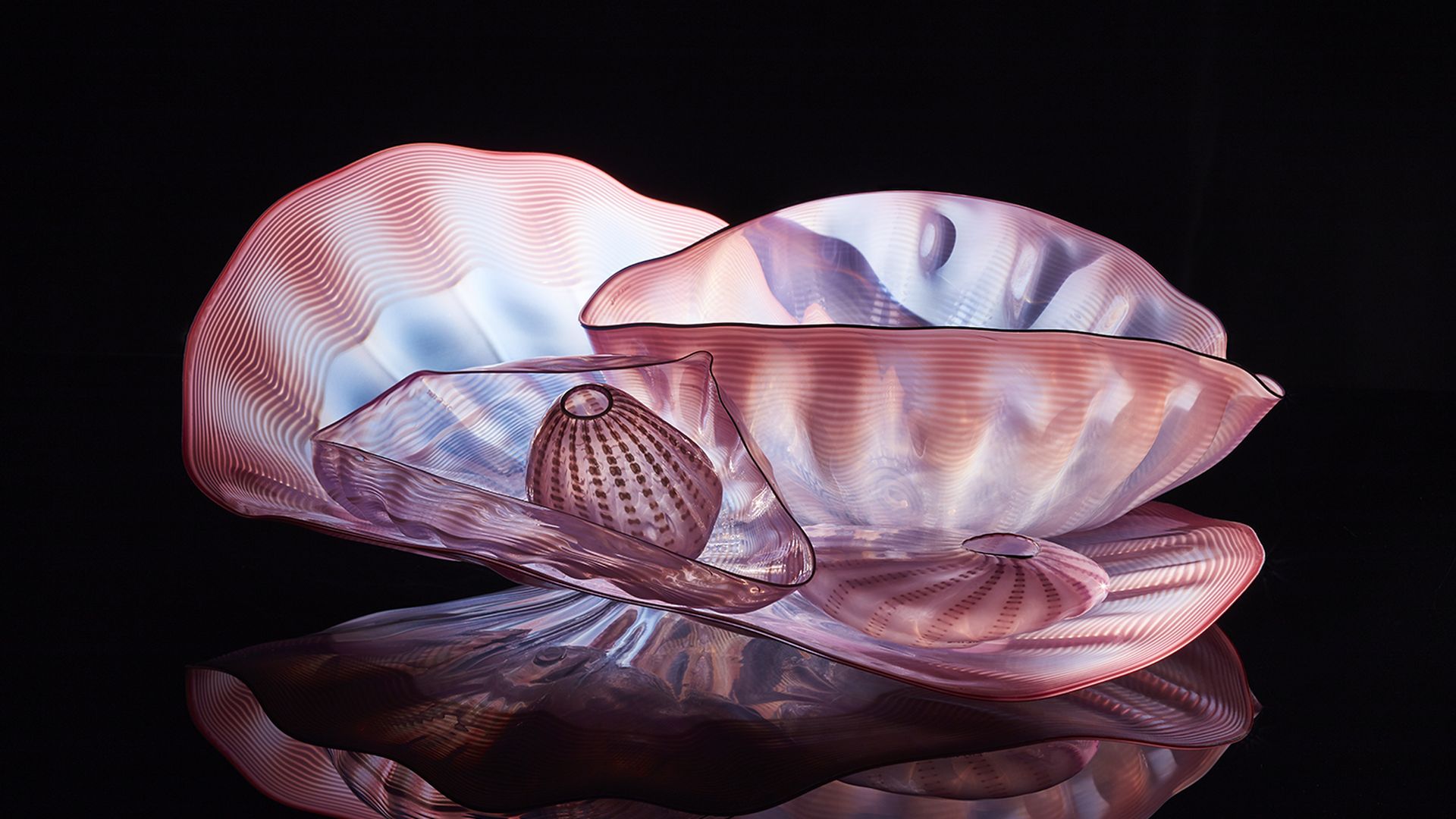 a large pink, blue and purple glass sculpture.