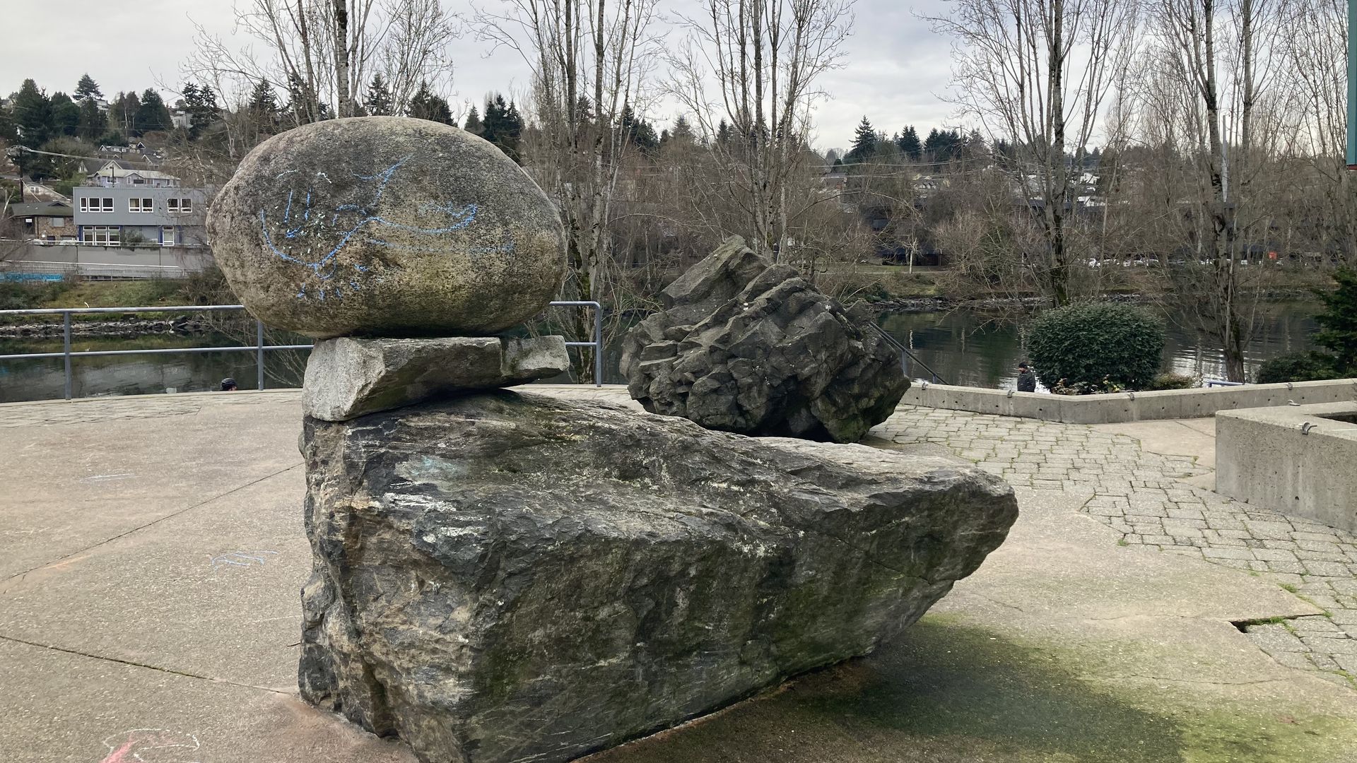 Stacked rocks make a sculpture on a concrete patio near Montlake Cut in Seattle. 