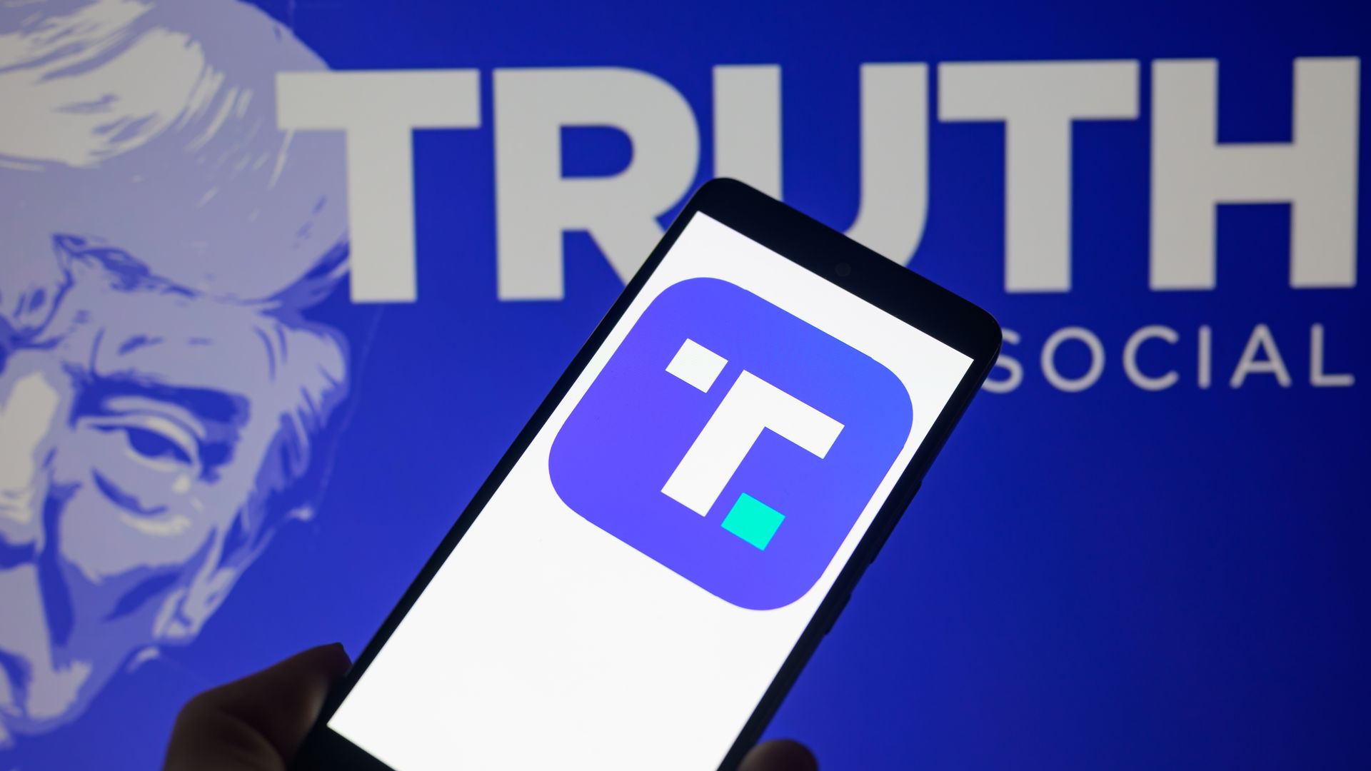 The Truth Social app icon is being displayed on a smartphone.