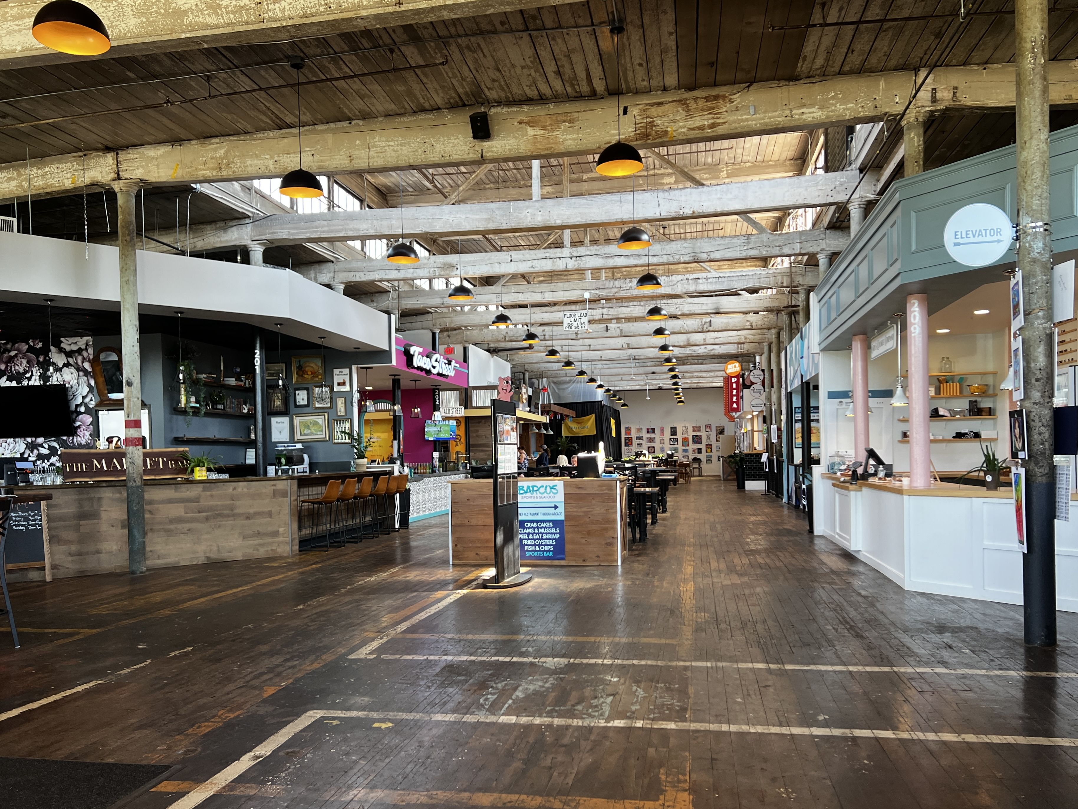 inside of food hall with multiple food stalls
