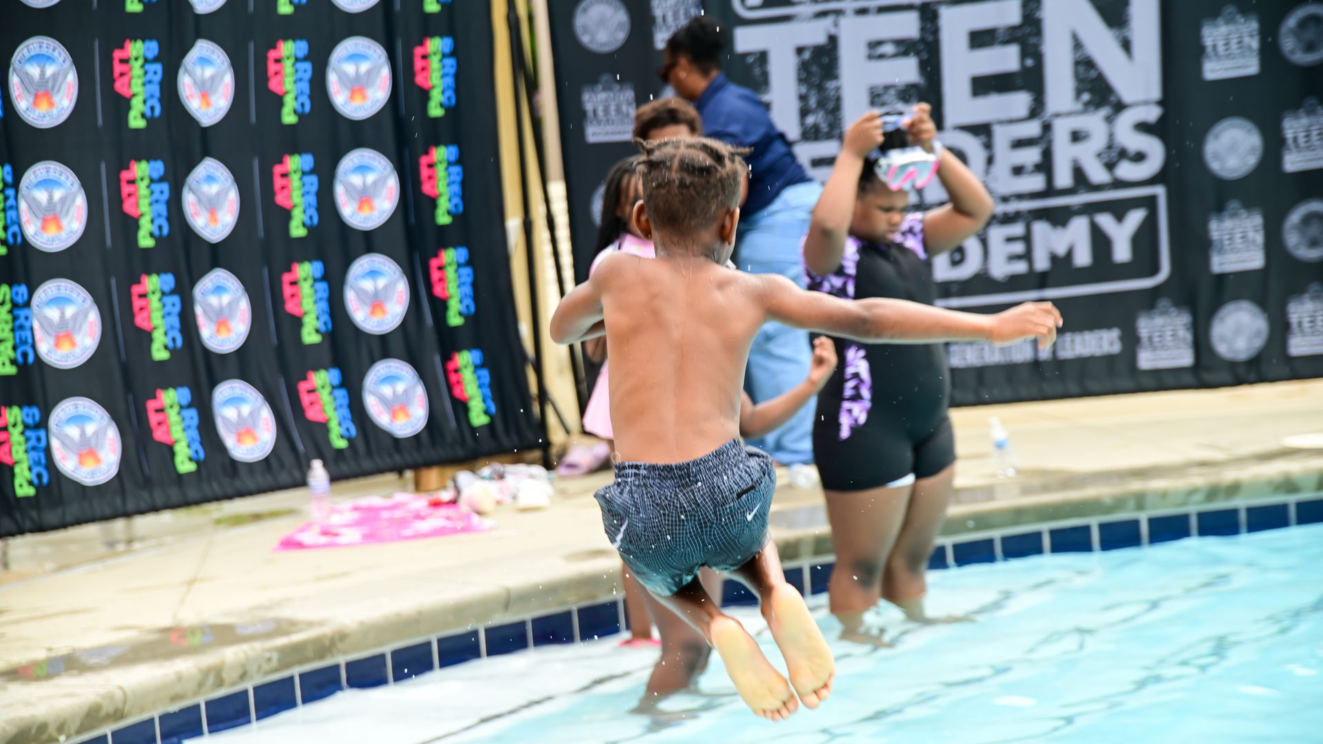 Children enjoy the swimming pool at the Dunbar Recreation Center in Atlanta.