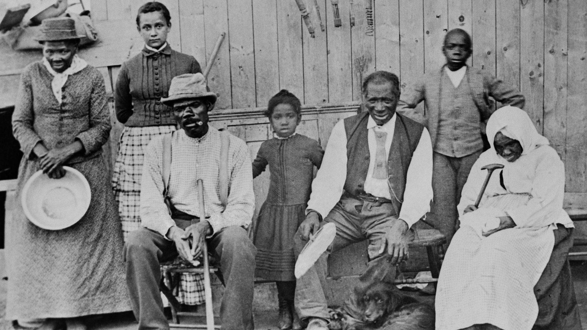American abolitionist Harriet Tubman is photographed with a group of formerly enslaved people she helped escaped. 