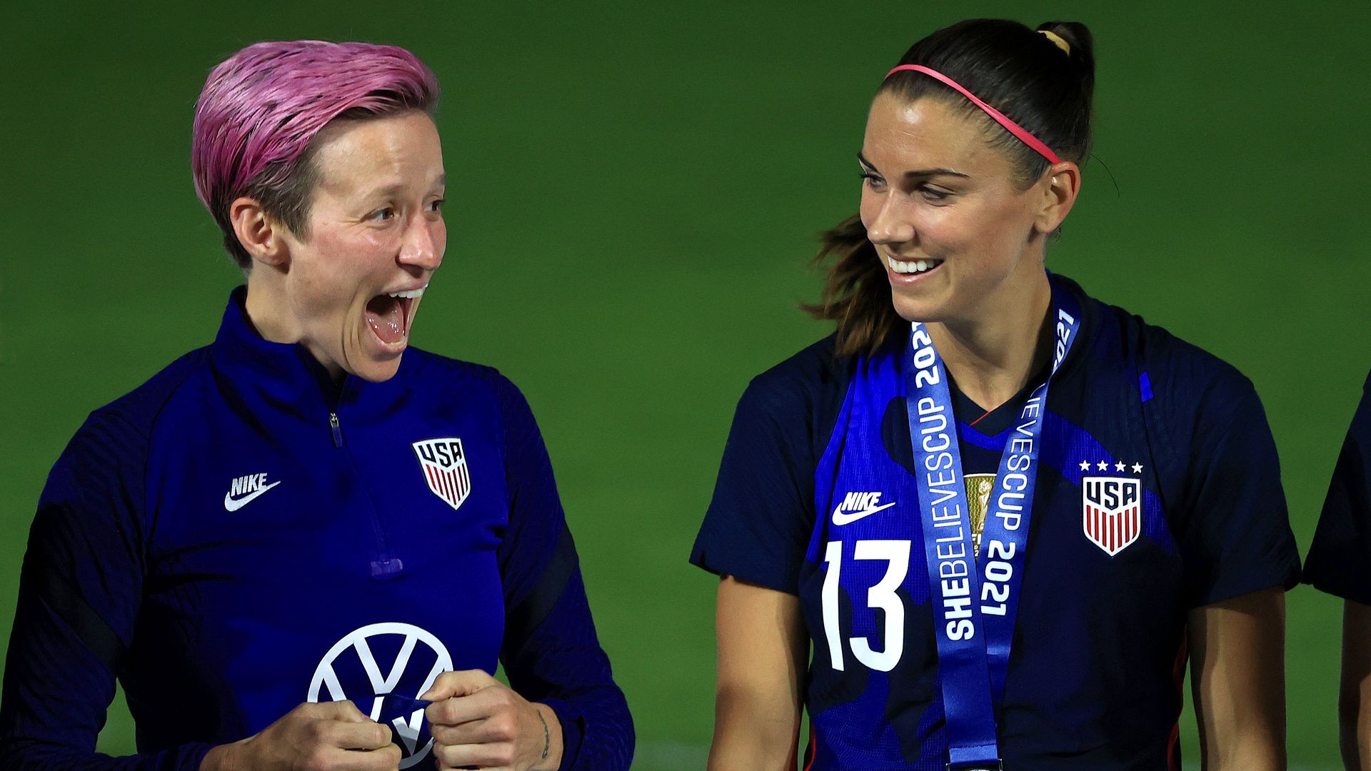 Megan Rapinoe #15 and Alex Morgan #13 of the United States celebrate winning the SheBelieves Cup at Exploria Stadium on February 24, 2021 in Orlando, Florida.