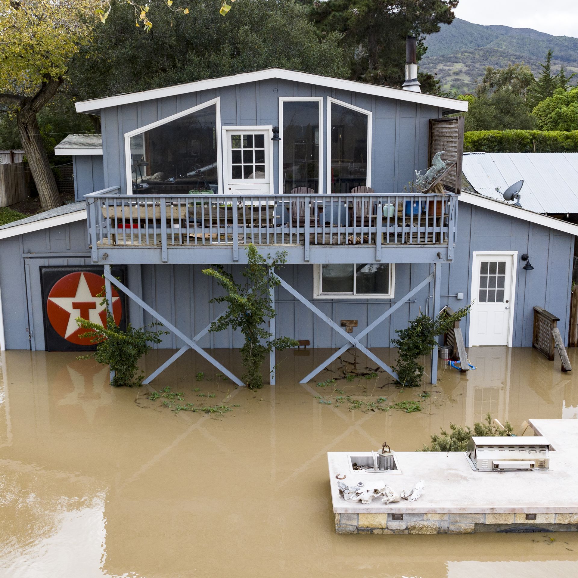 Floodwaters from the overflowing Salinas River surround a home in Salinas, California, on Jan. 13.