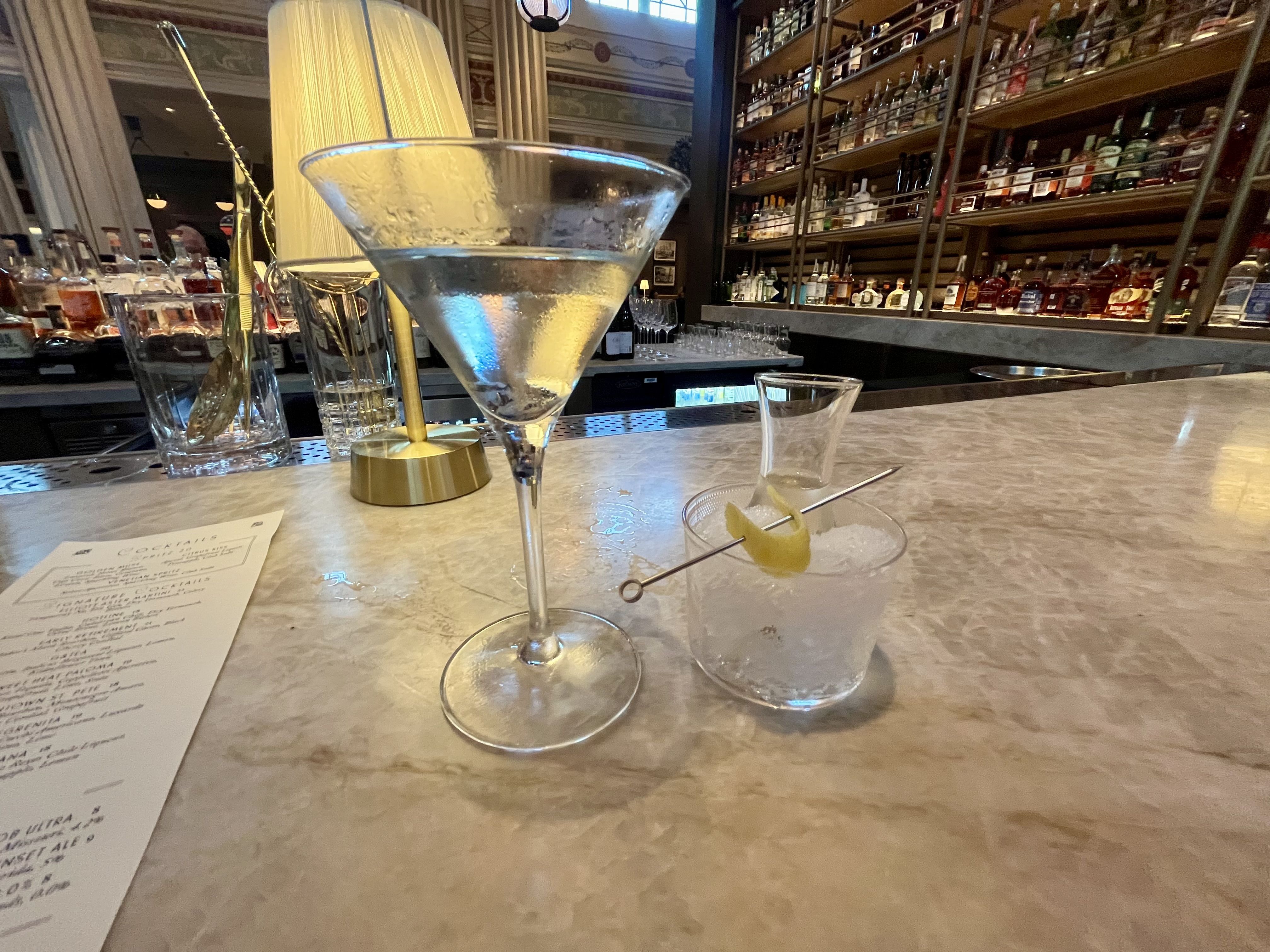 A martini sitting on a bar.
