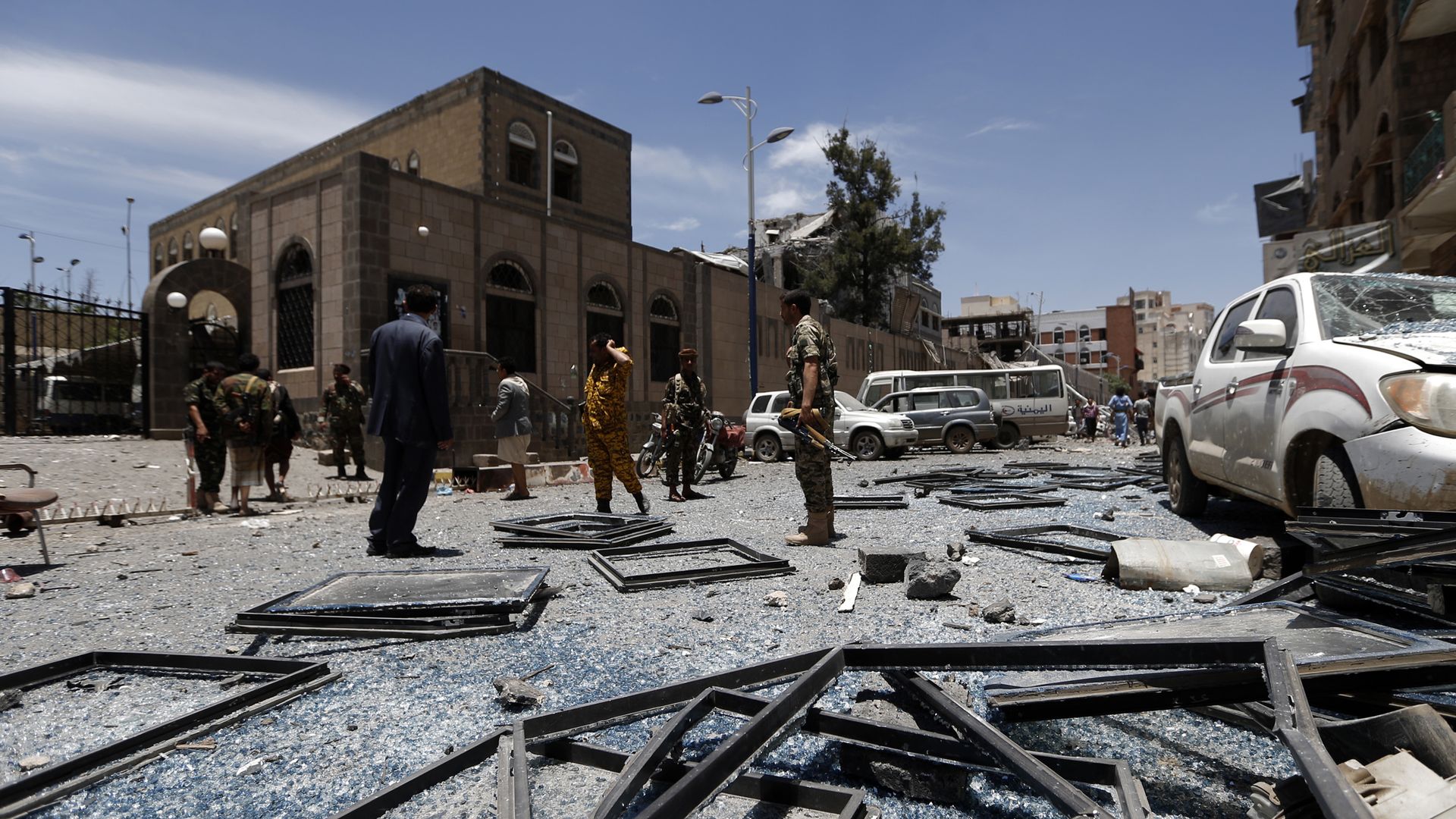 Yemenis check the site of air strikes at the president office in the capital Sanaa last month.  