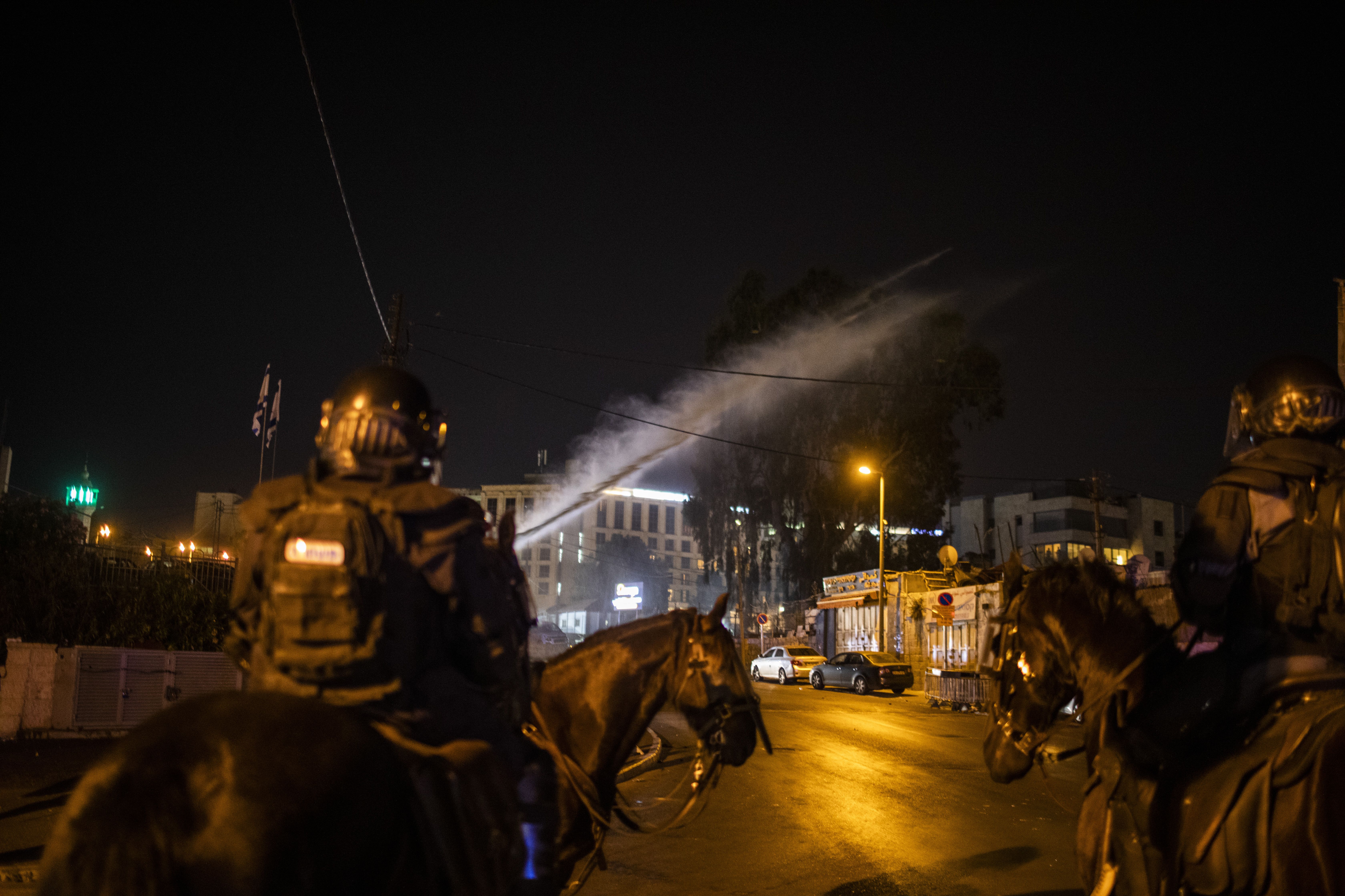  Israeli security forces use a water cannon to disperse protestors during a demonstration against the planned eviction process for the Palestinians in the Sheikh Jarrah neighbourhood. 