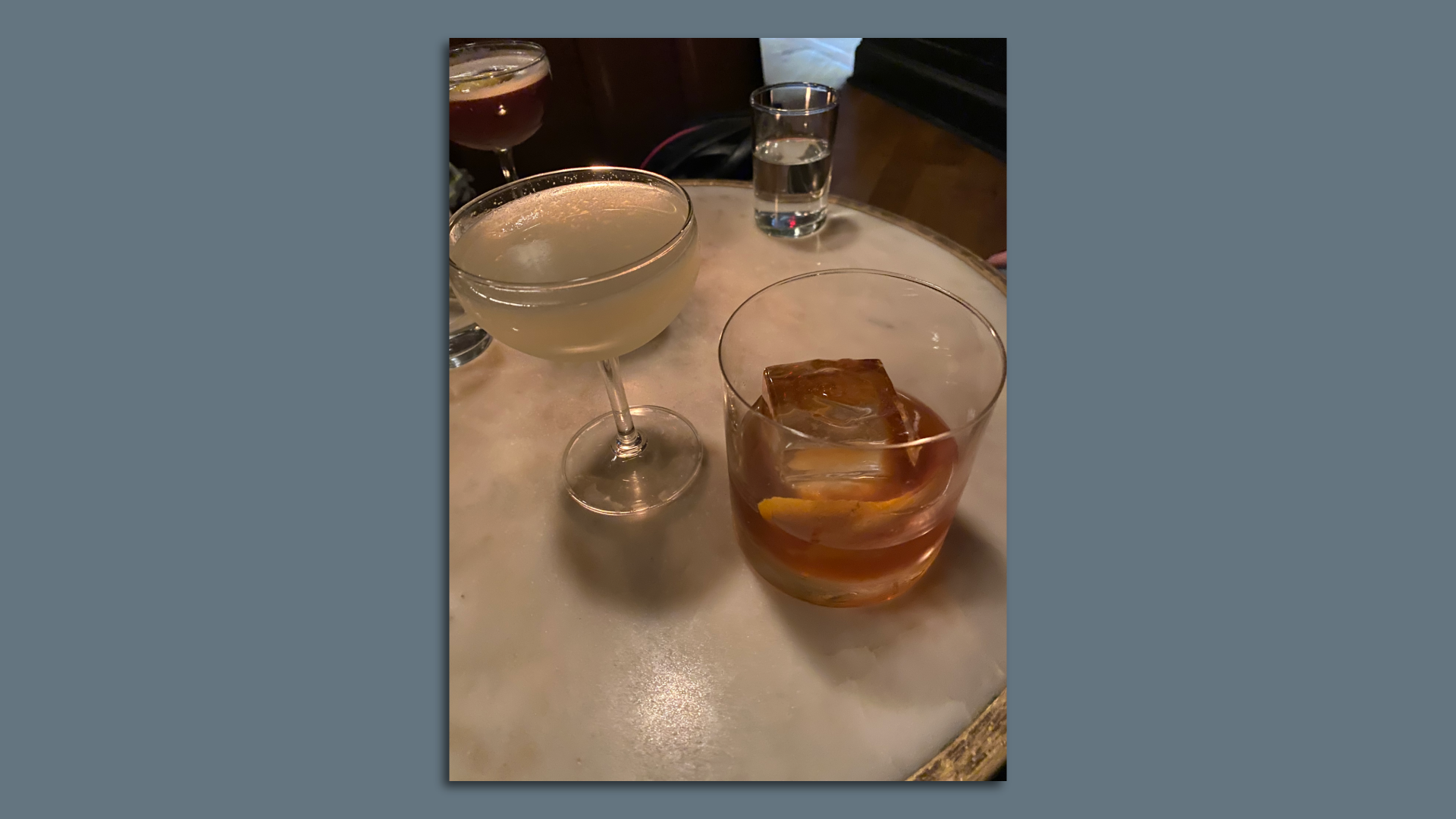 Two cocktails on a table. 