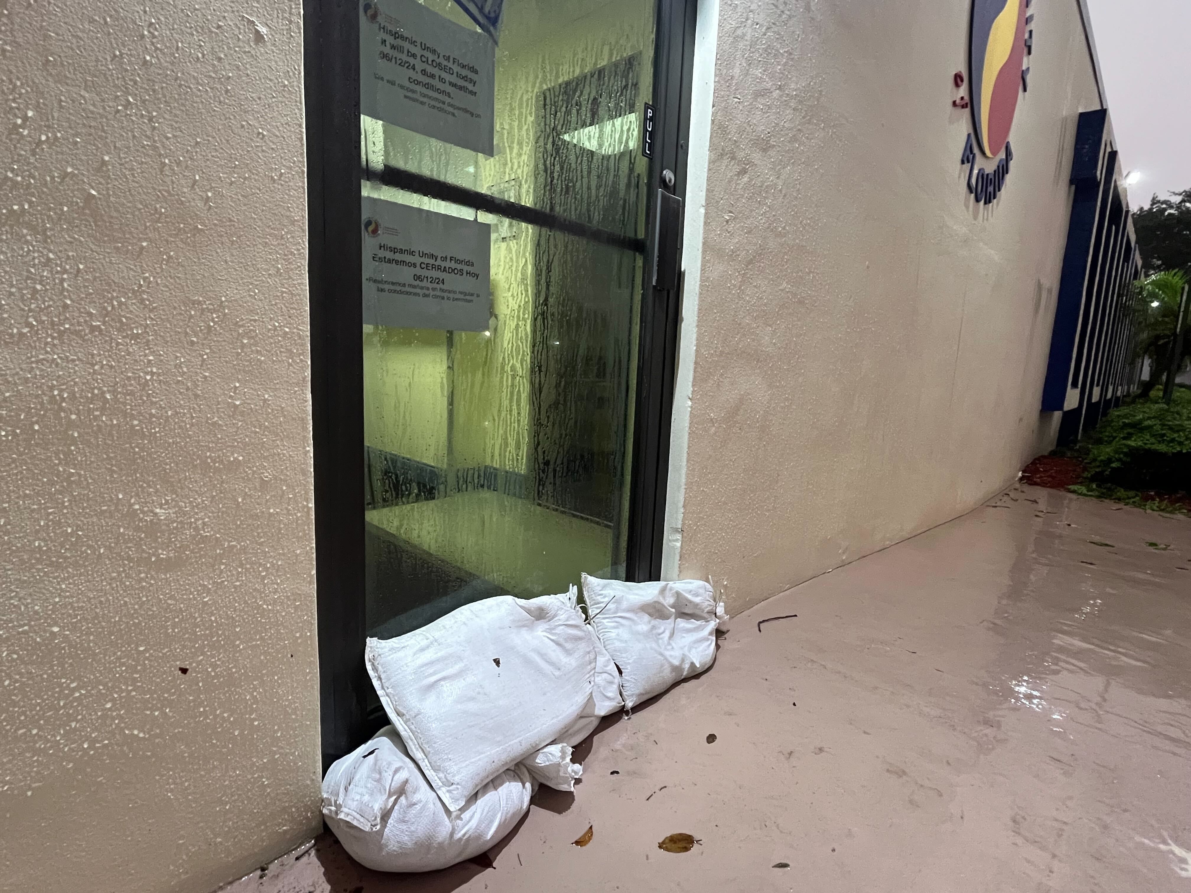 Hispanic Unity of Florida, in Hollywood, closed early for the storm and put sandbags out to block flood waters. The water in its parking lot was shin high.