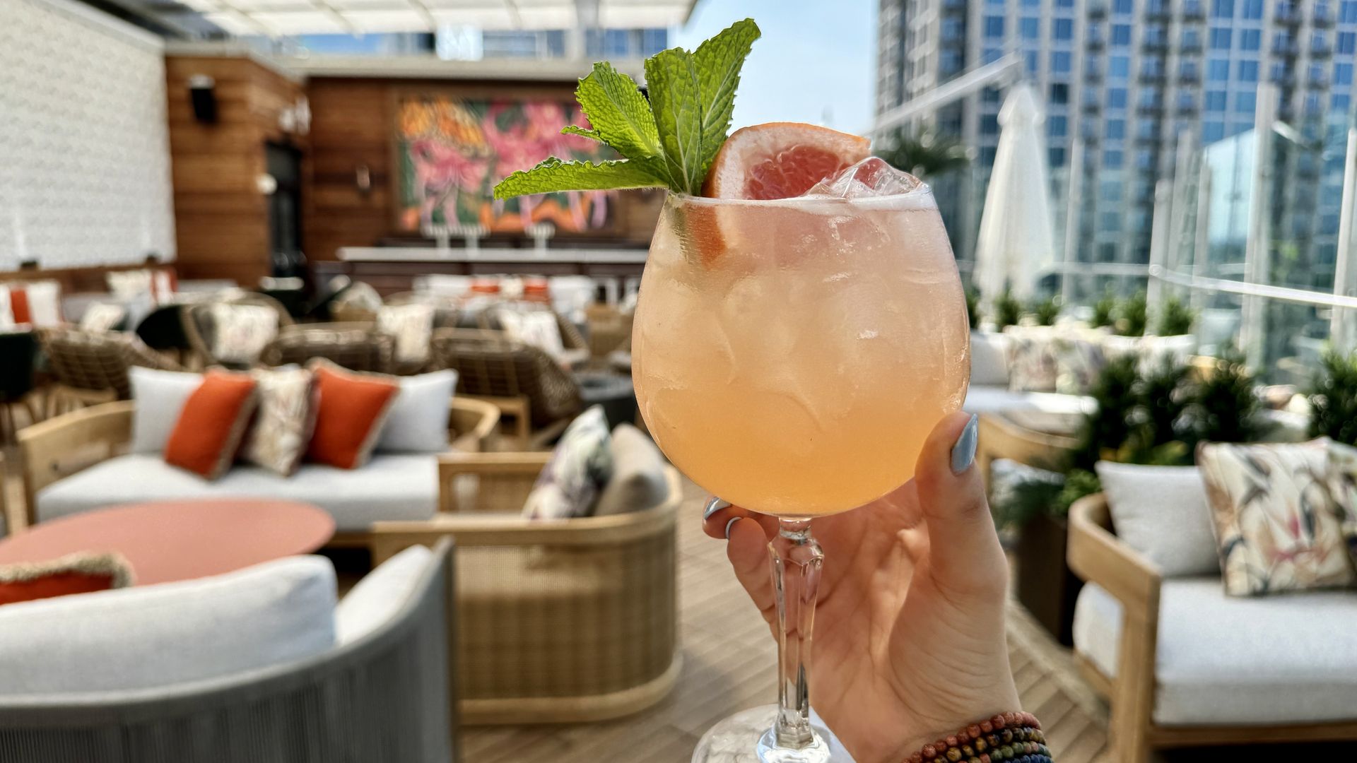 hand holding a cocktail