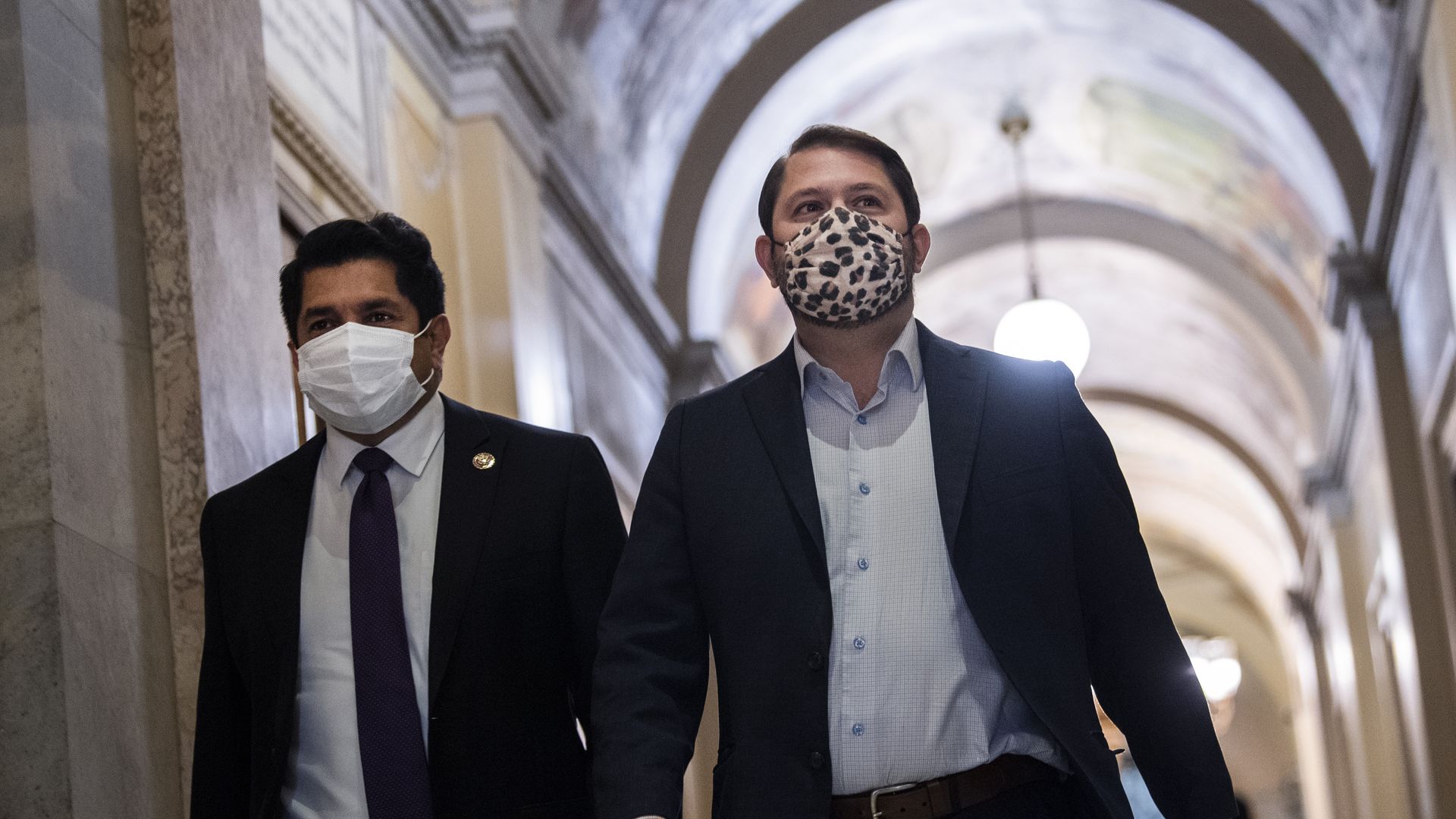 Reps. Ruben Gallego, D-Ariz., right, and Jimmy Gomez, D-Calif., arrive to a meeting with President Joe Biden and the House Democratic Caucus on the reconciliation package in the U.S. Capitol.