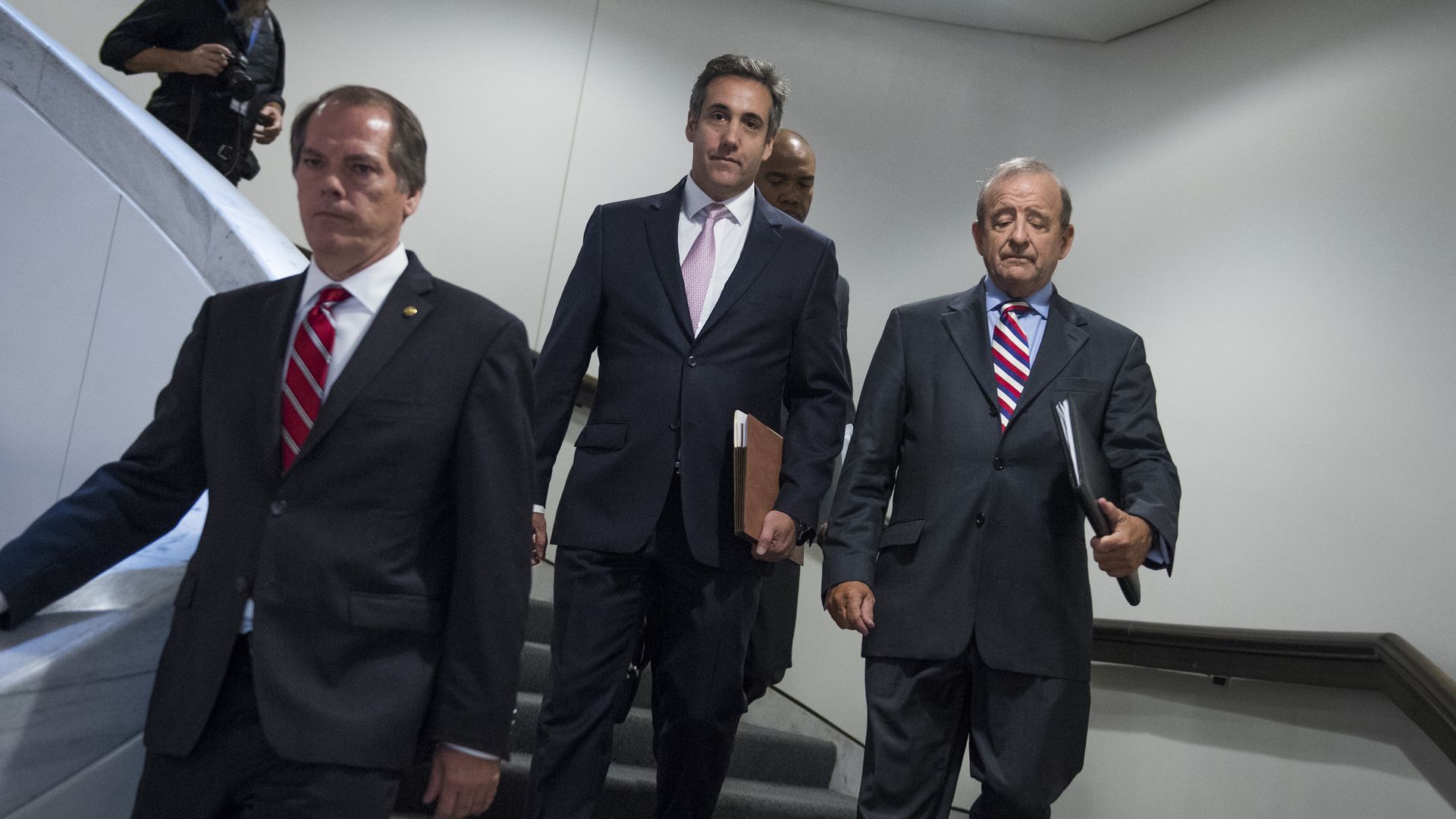Michael Cohen, center, following his meeting with the Senate Intelligence Committee. Photo: By Tom Williams / CQ Roll Call