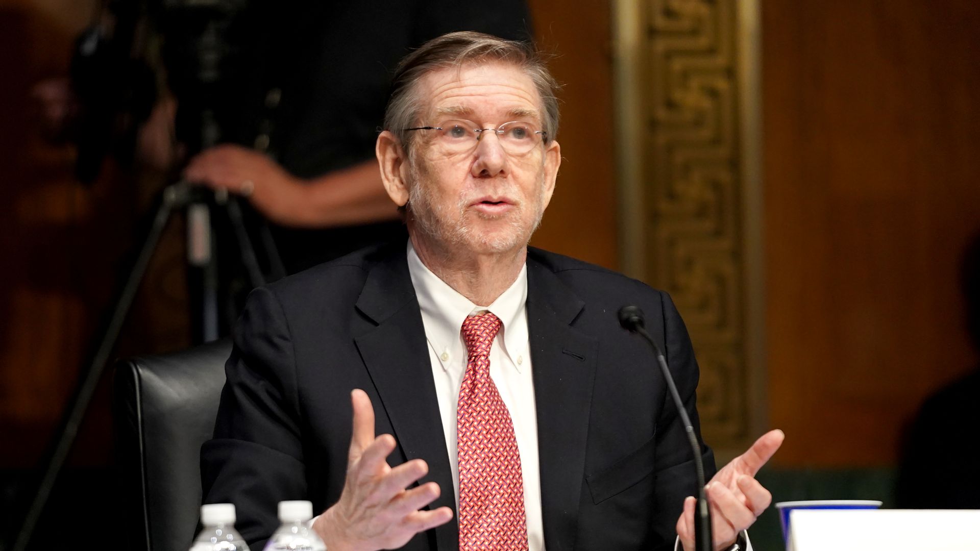 Photo of David Kessler speaking in a hearing while gesturing with his hands