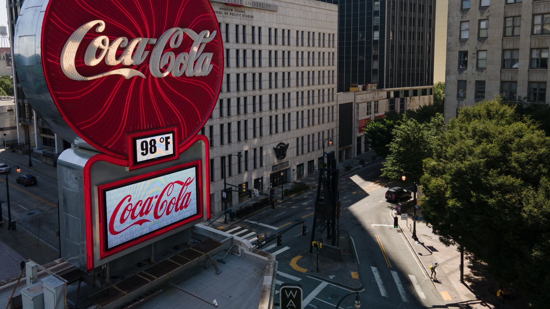 A large neon Coca-Cola sign is shown overlooking Downtown Atlanta. 