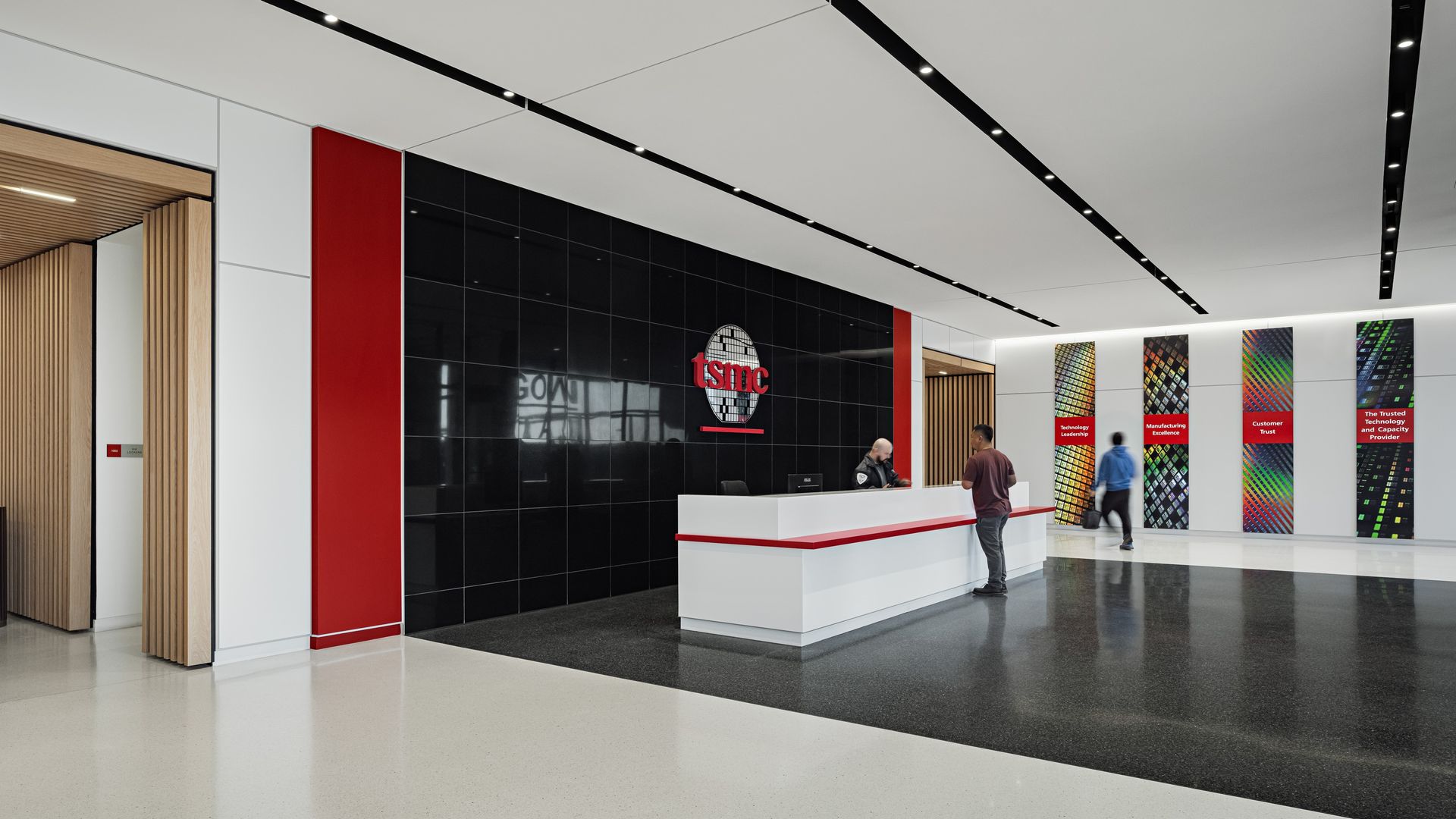 A lobby with a sign that says, "TSMC."