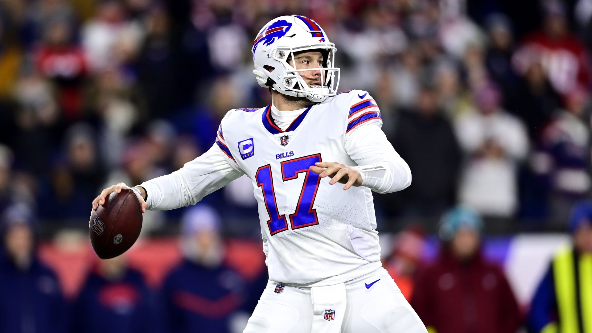 Buffalo Bills quarterback Josh Allen throwing a football during a game. 
