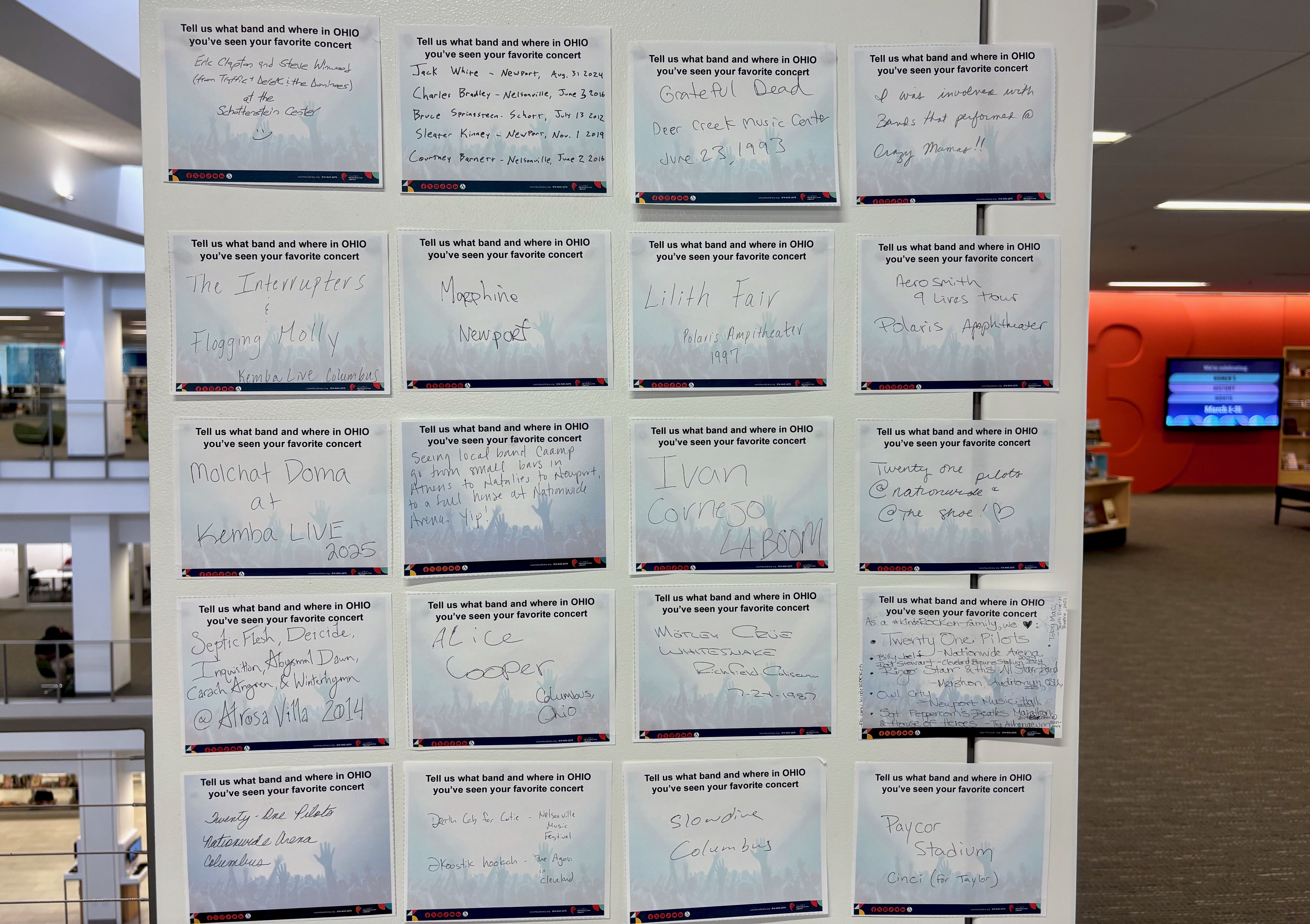 Notes about visitors' favorite concerts line a wall at the Main Library