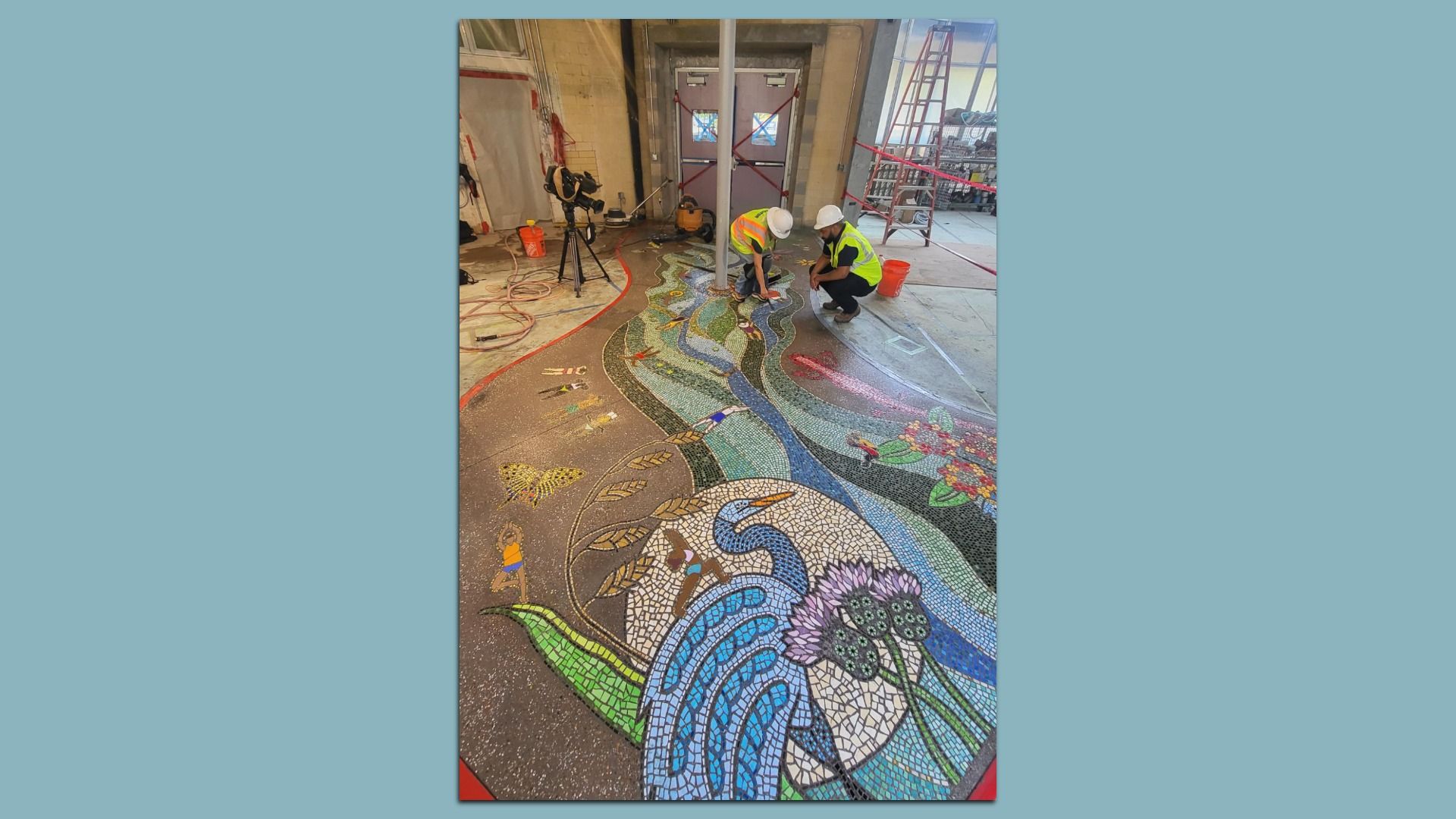 Workers laying a mosaic.