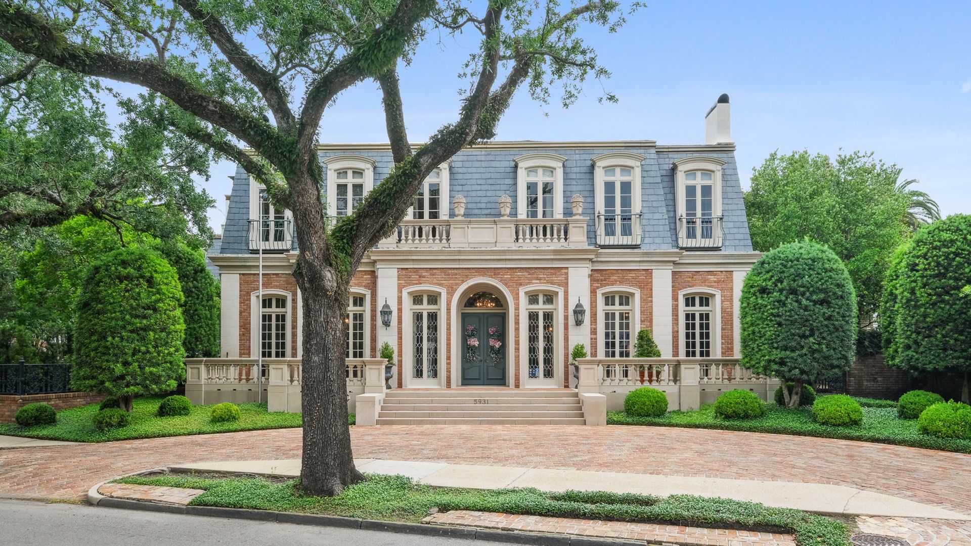 The facade of a home at 5931 St. Charles Avenue shows French influence.