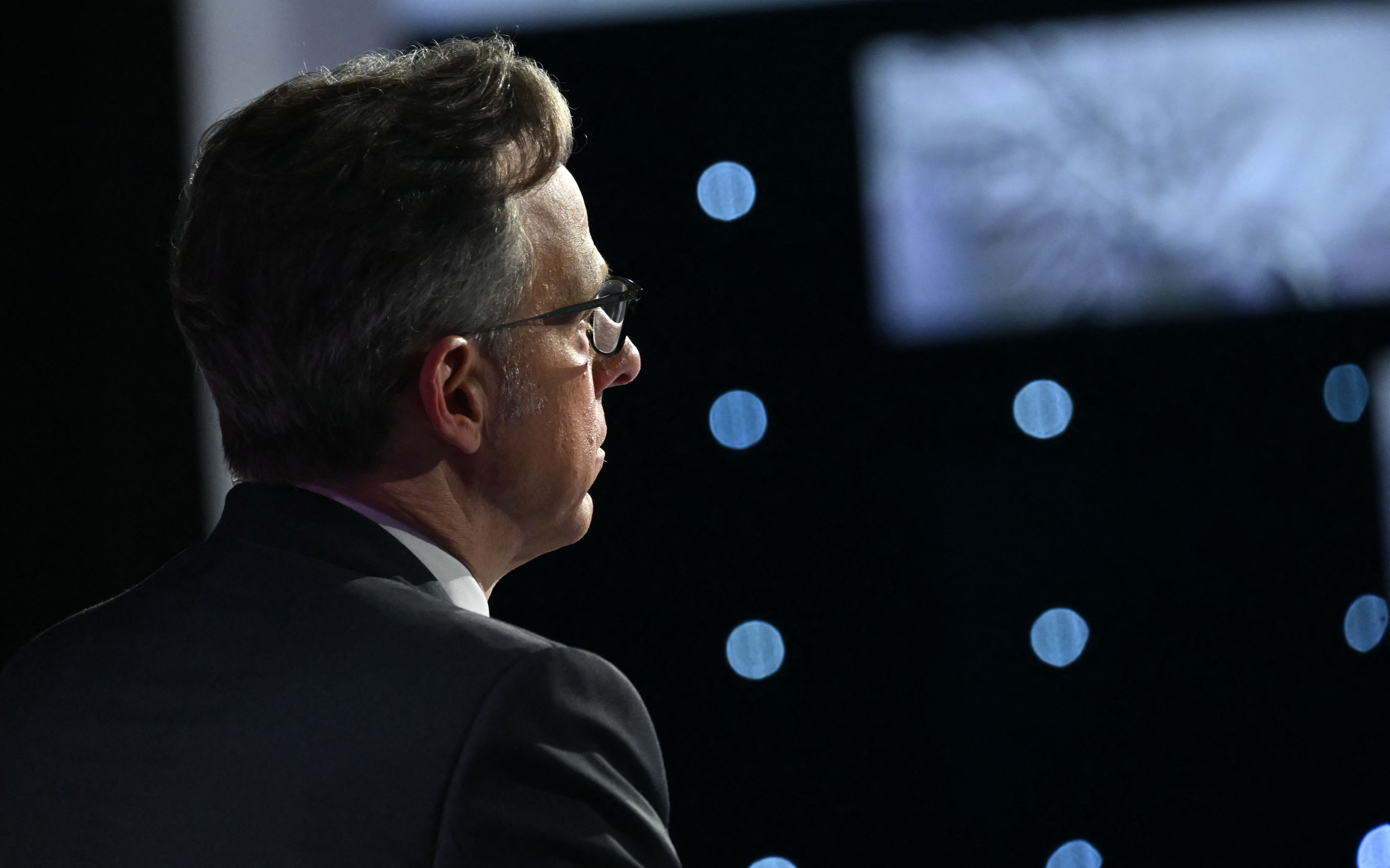 Moderator CNN journalist Jake Tapper looks on during the first presidential debate of the 2024 elections between US President Joe Biden and former US President and Republican presidential candidate Donald Trump at the CNN's studios in Atlanta, Georgia, on June 27, 2024. 