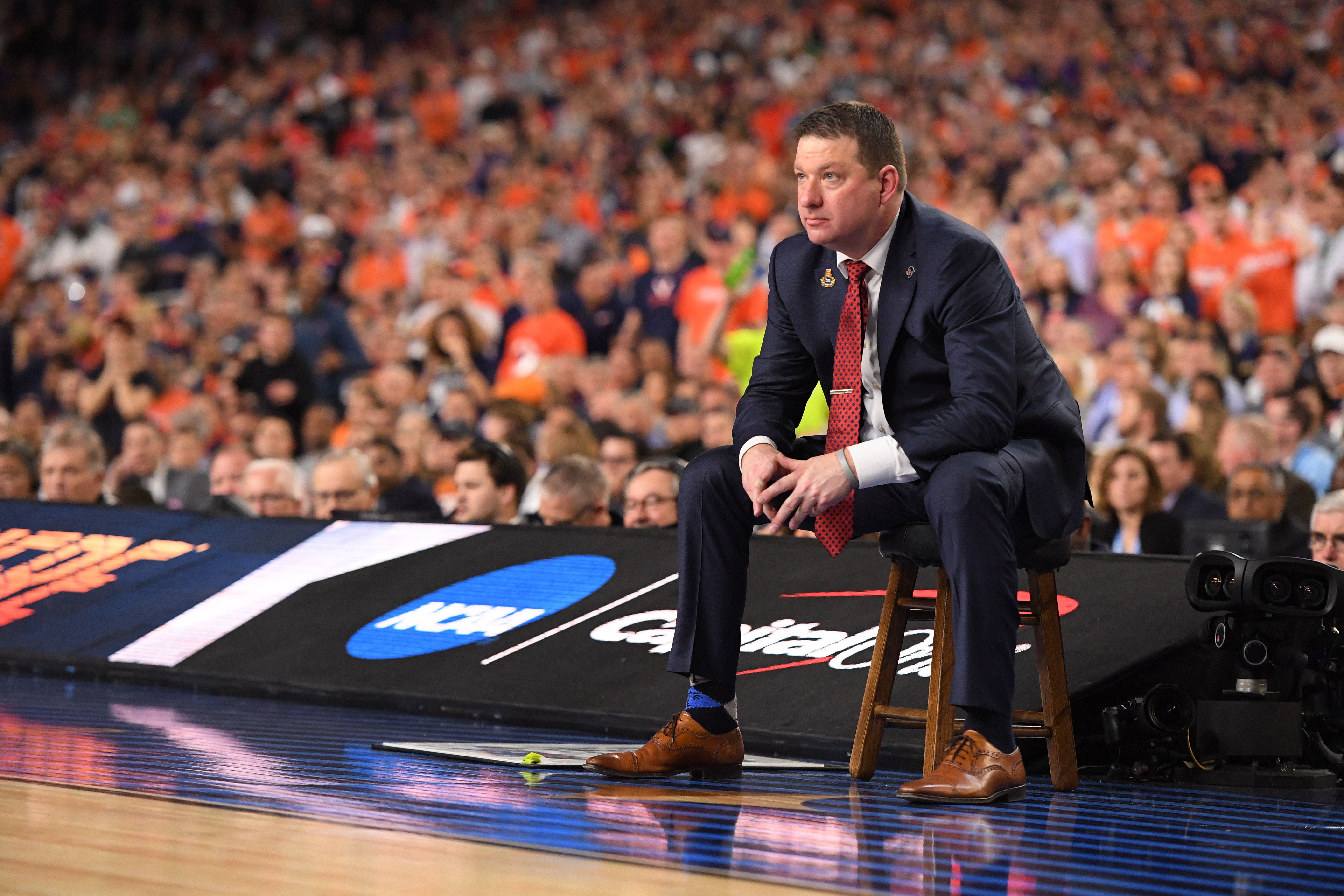 Chris Beard sitting on a stool