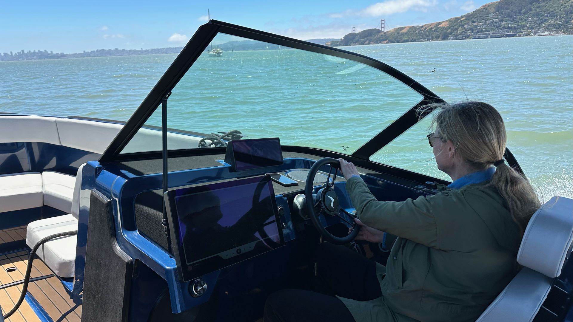 Axios reporter Katie Fehrenbacher driving the Arc Sport in the bay of Sausalito, Calif.