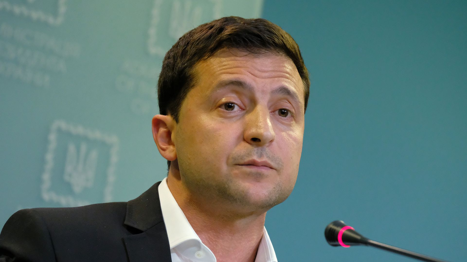 Photo of Volodymyr Zelensky looking downward