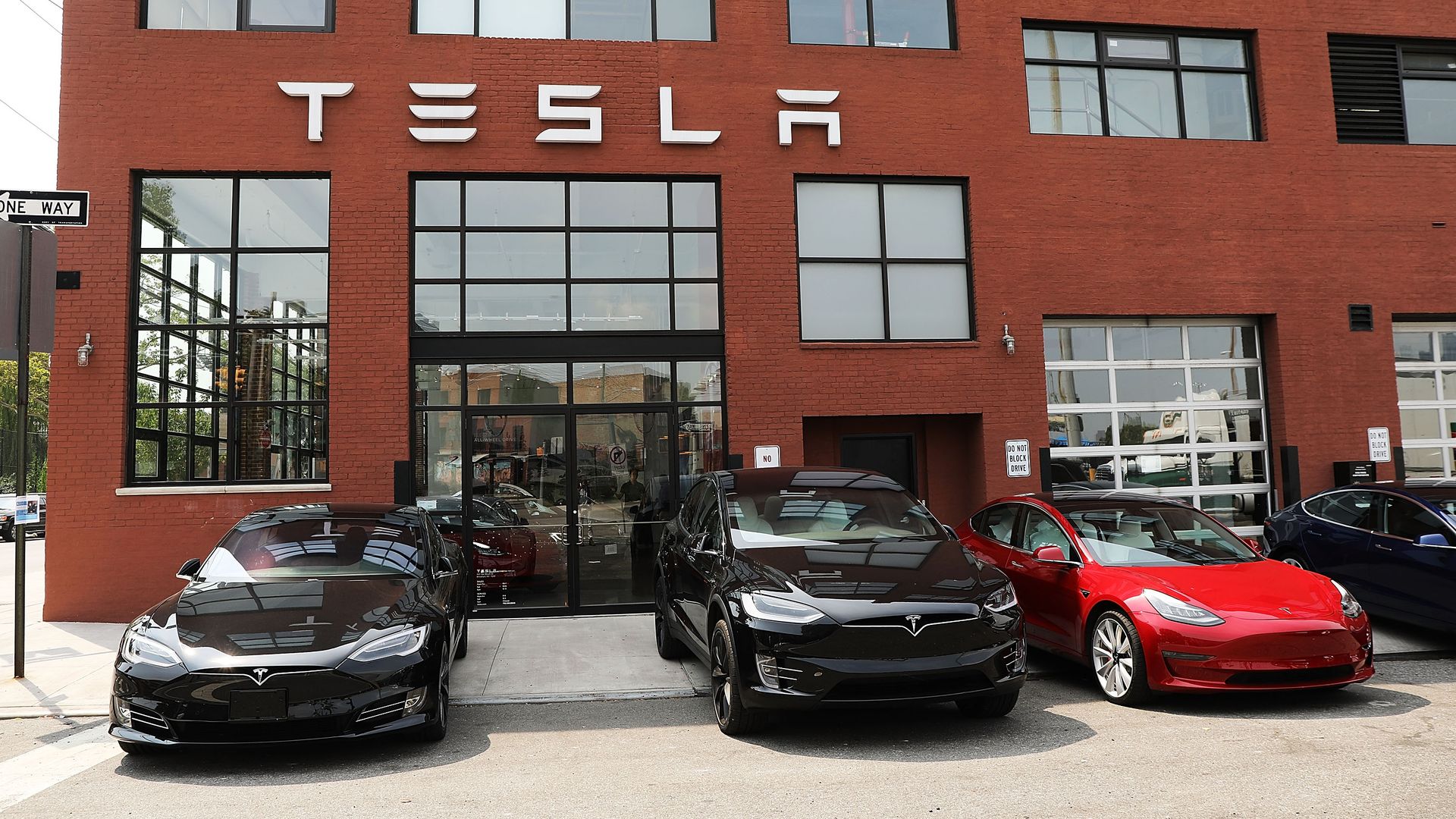 Tesla vehicles stand outside of a Brooklyn showroom and service center on August 27, 2018 in New York City.