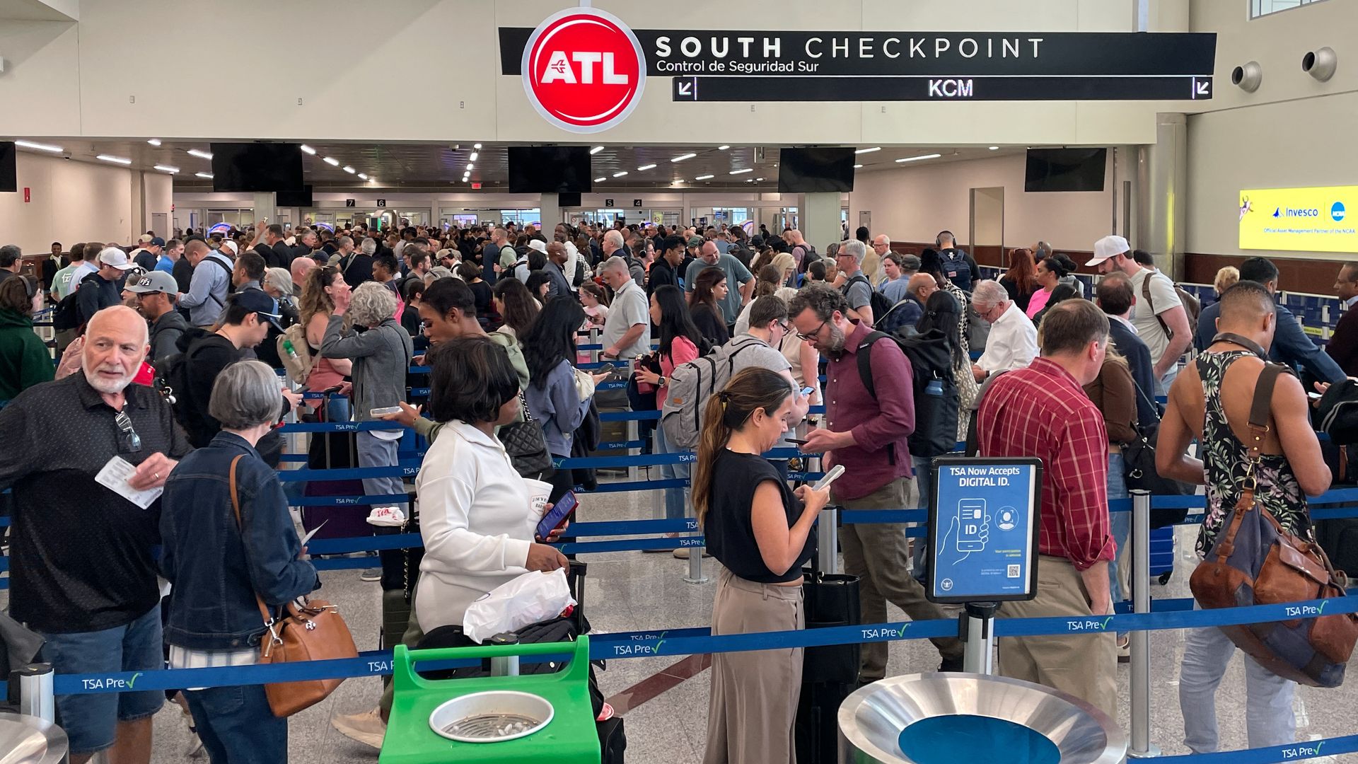 Rows of travelers wait in line at the South Checkpoint area at the Atlanta airport.