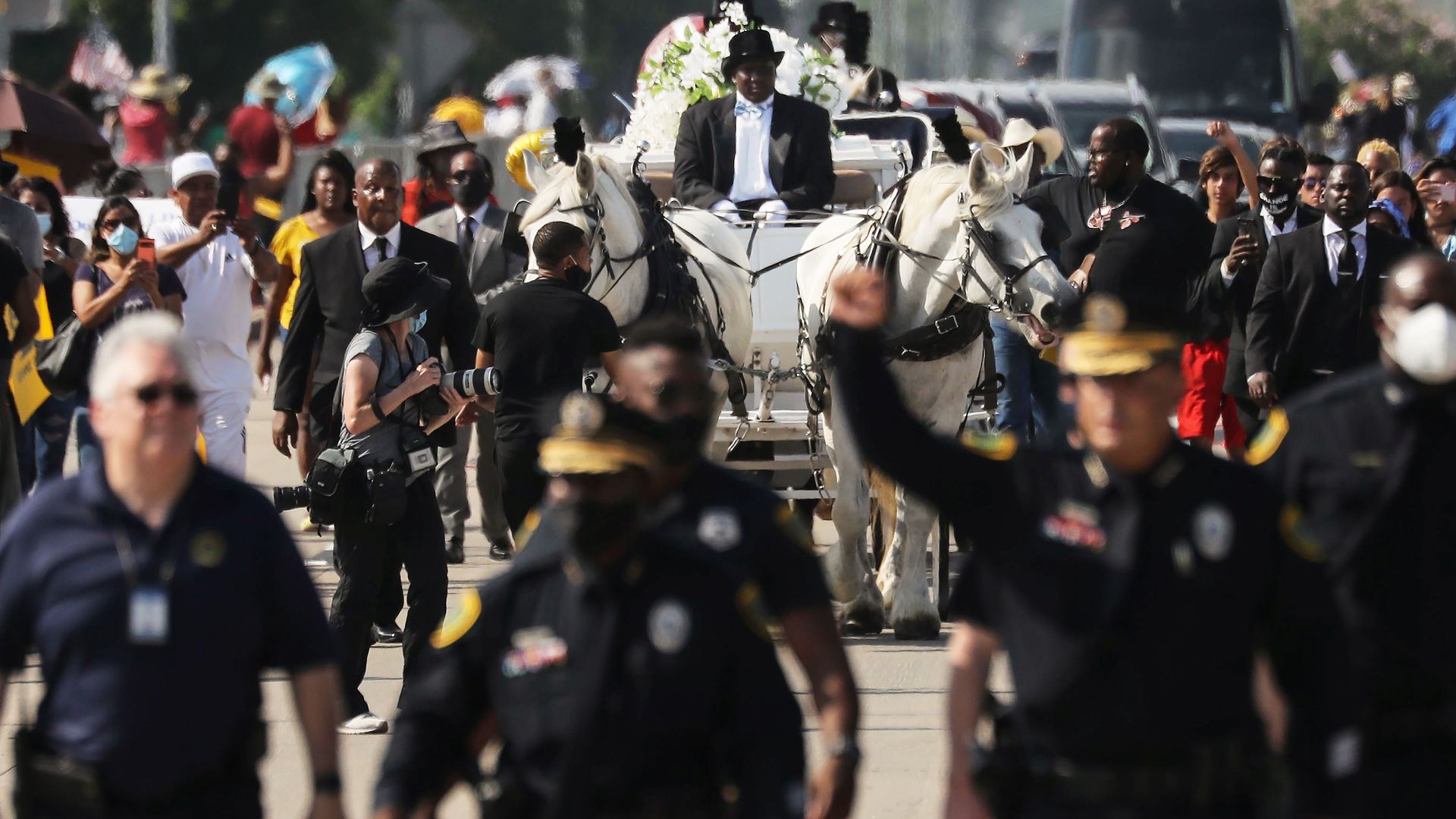 Former Houston Police Chief Art Acevedo raises his fist while escorting the body of longtime Houstonian George Floyd, who was murdered by Minneapolis police officers in 2020