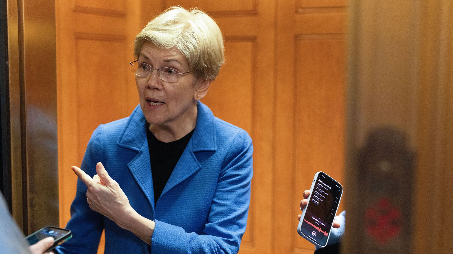 Sen. Warren outside the Senate chamber talking