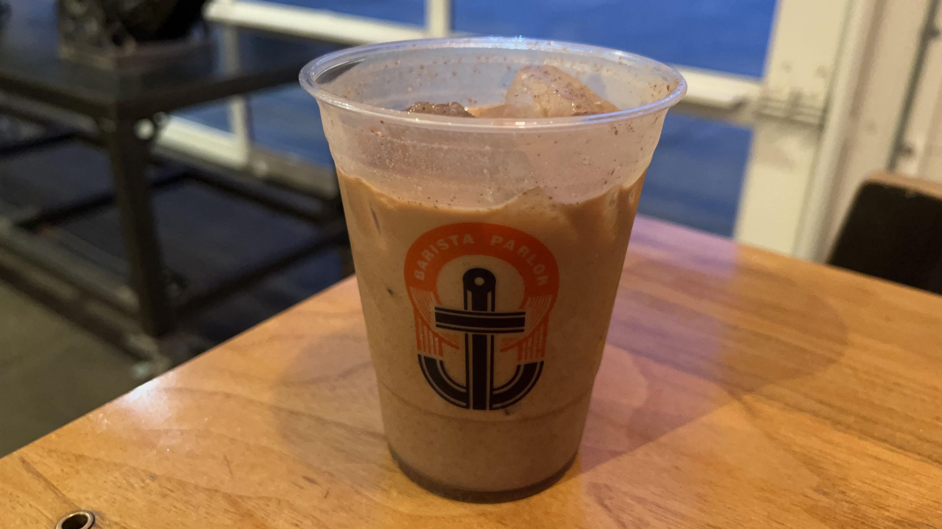 The spiced cold brew in a to-go cup at Barista Parlor.
