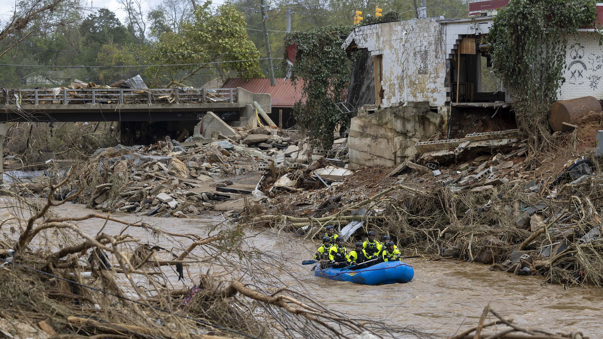A rescue team paddles down the Swannanoa River on Sunday, Sept. 29, 2024. The remnants of Hurricane Helene caused widespread flooding, downed trees, and power outages in western North Carolina. (Travis Long/The News & Observer/Tribune News Service via Getty Images)
